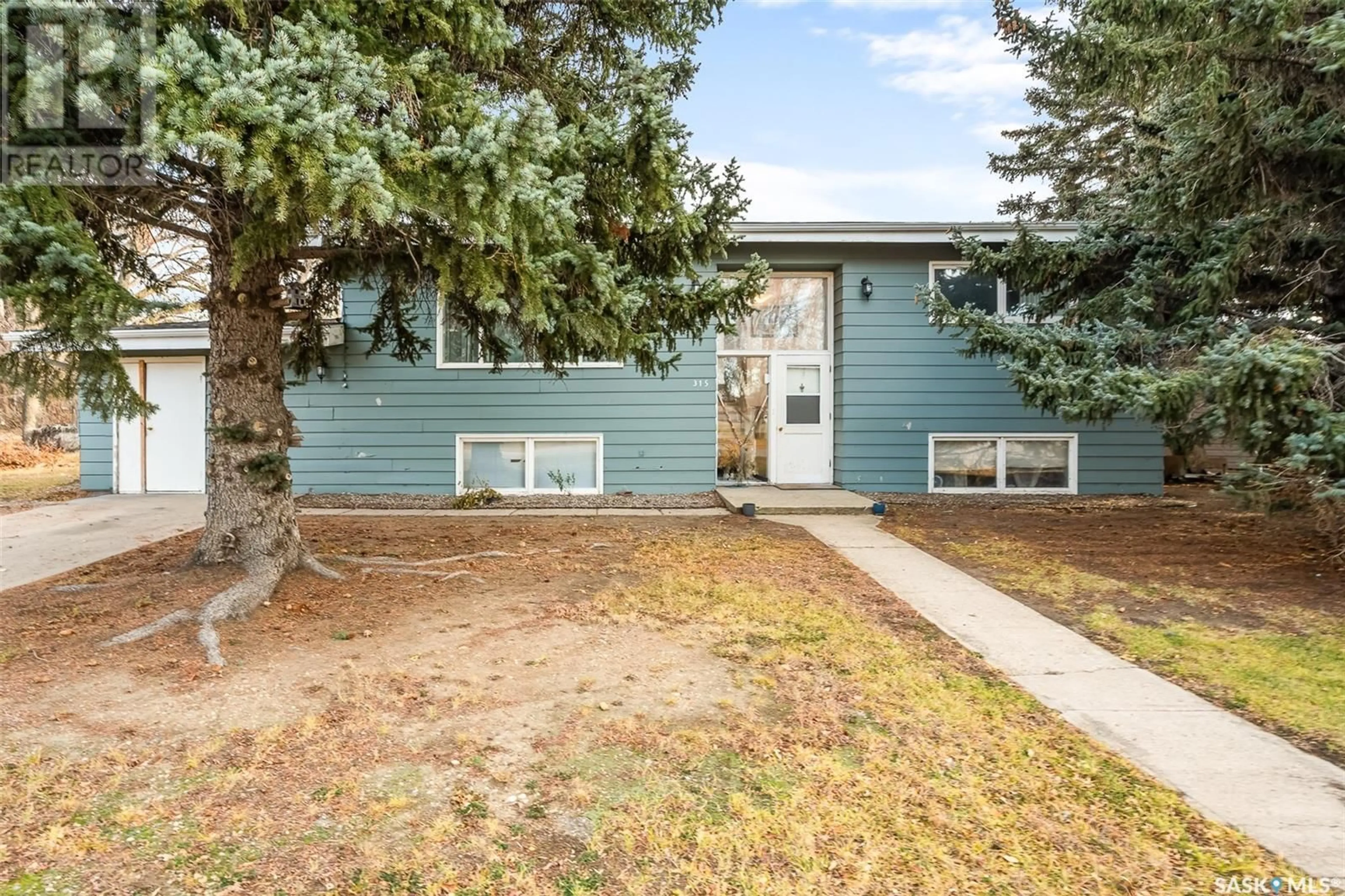 A pic from exterior of the house or condo, the fenced backyard for 315 Birch STREET, Caronport Saskatchewan S0H0S0