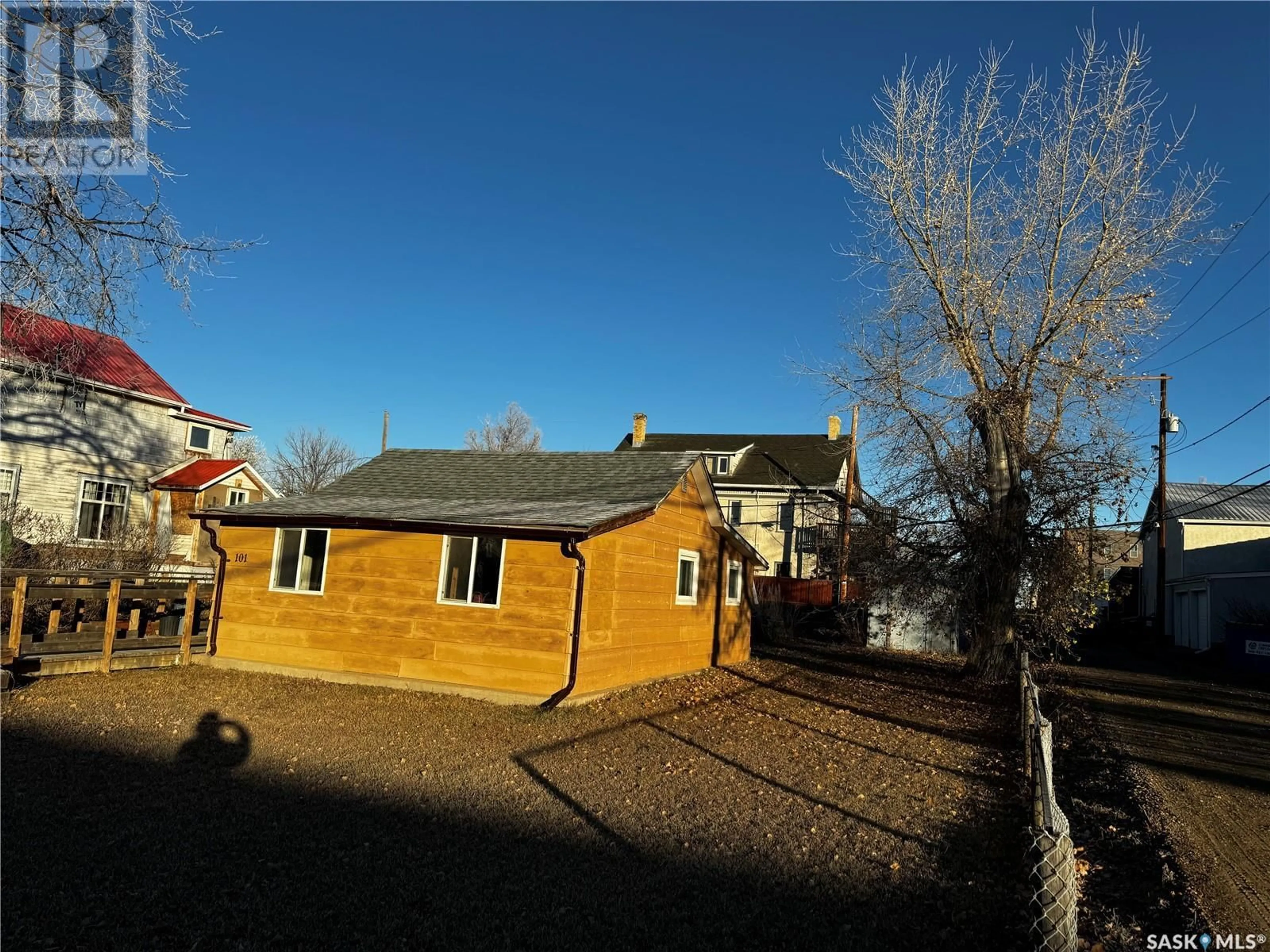 Frontside or backside of a home, the fenced backyard for 101 4th AVENUE W, Gravelbourg Saskatchewan S0H1X0