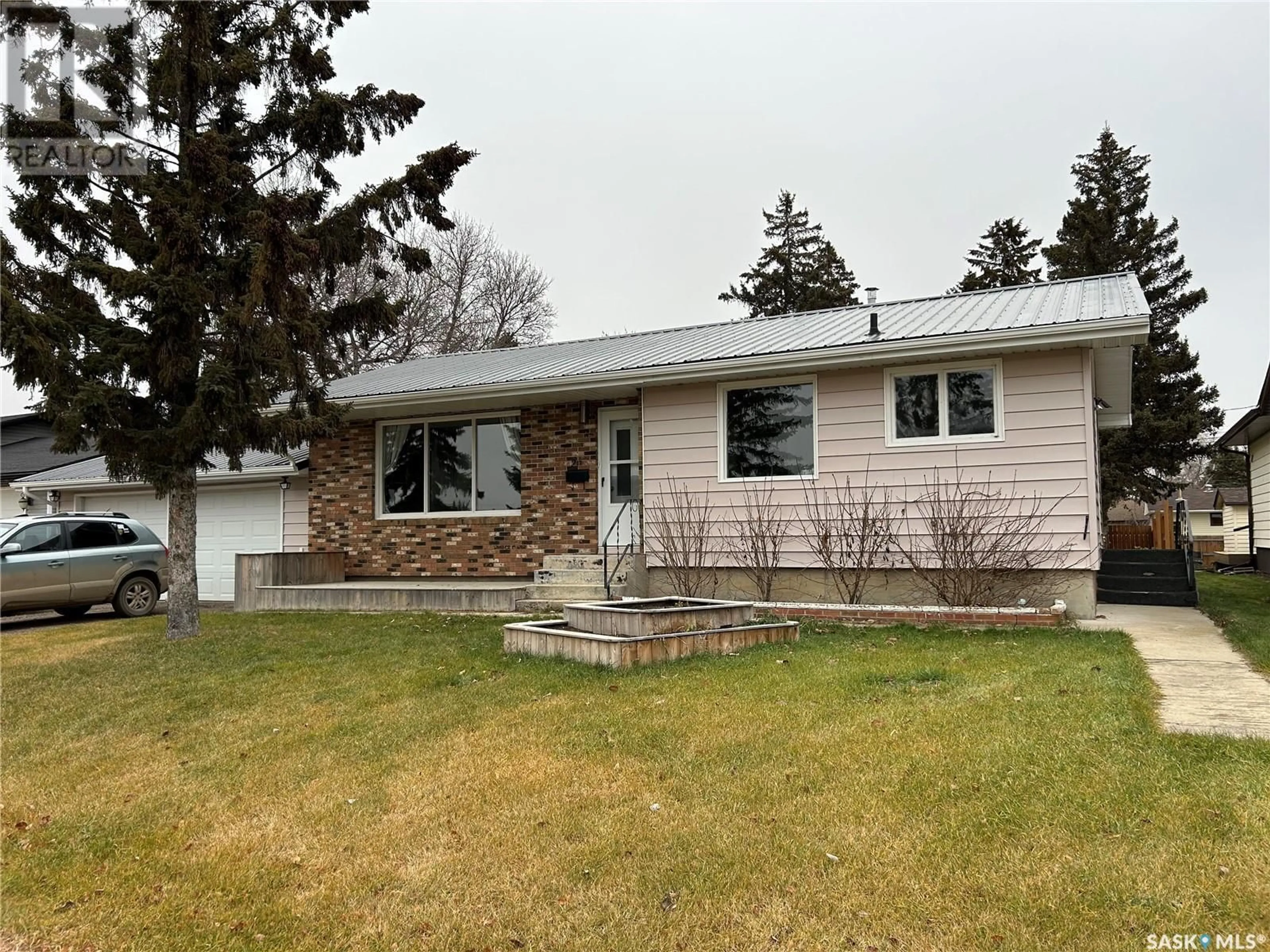 Frontside or backside of a home, the street view for 217 3Rd AVENUE, Rosthern Saskatchewan S0K3R0