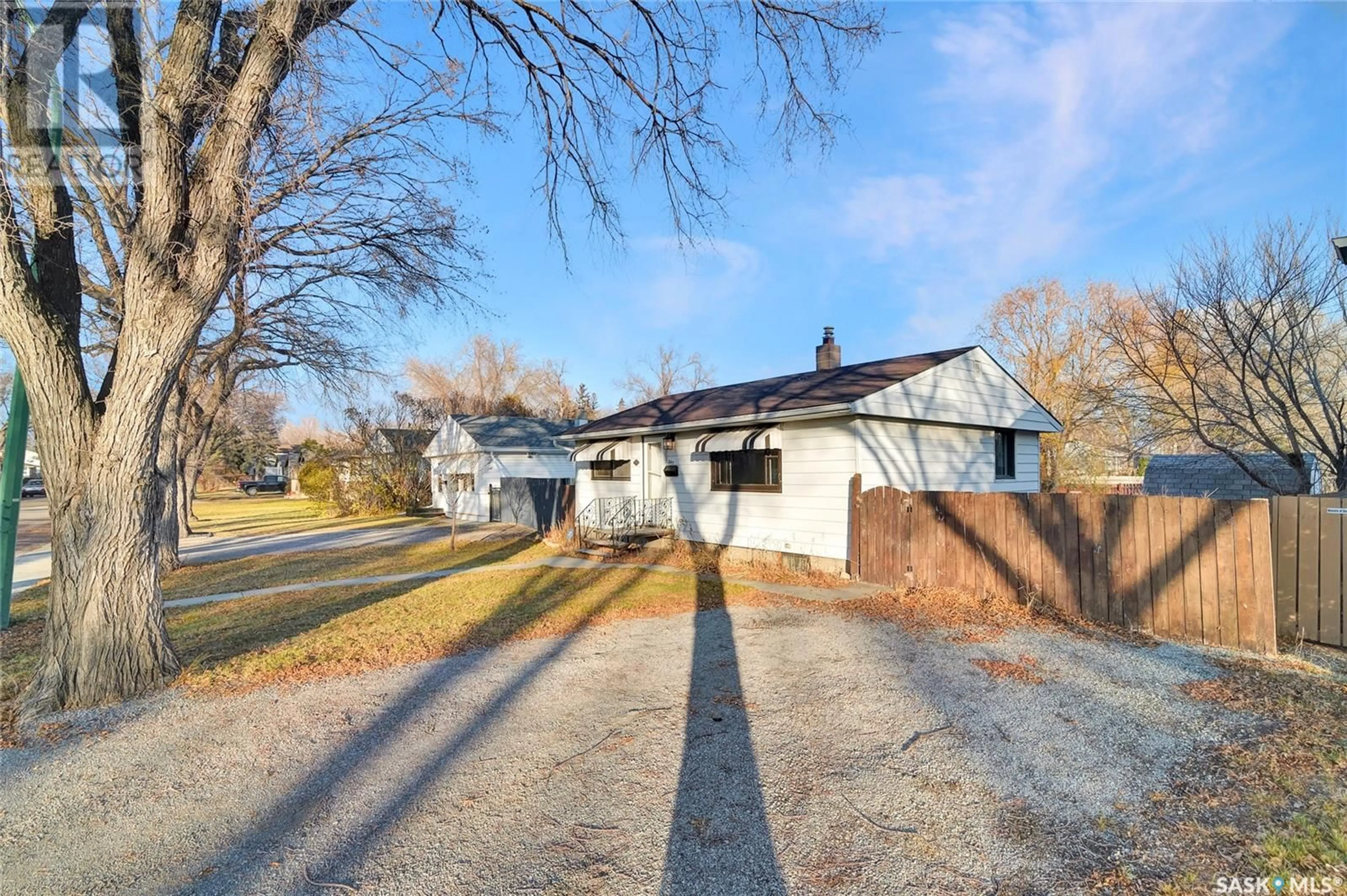 Frontside or backside of a home, the fenced backyard for 247 Smith STREET, Regina Saskatchewan S4R2K8