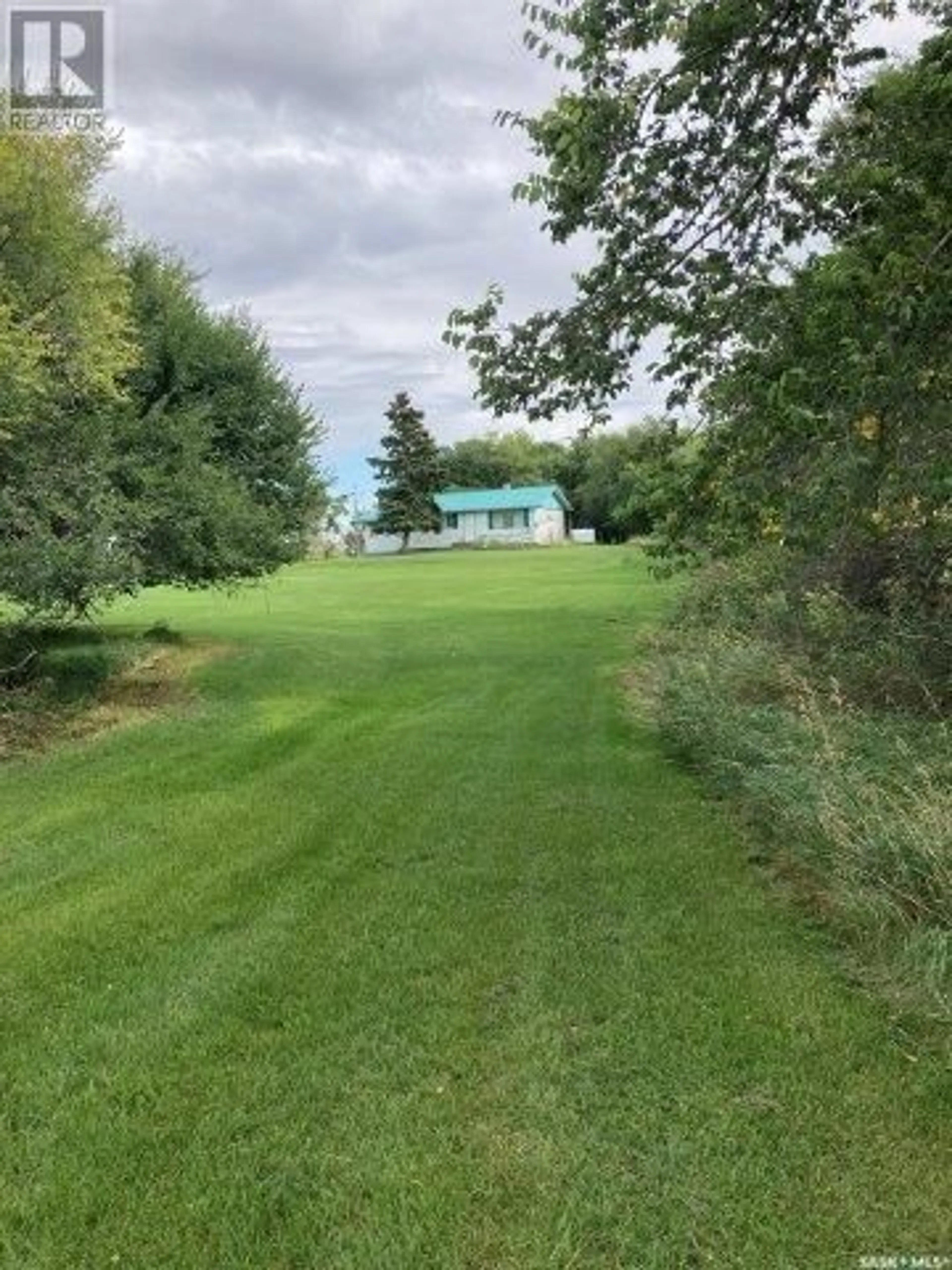 A pic from exterior of the house or condo, the fenced backyard for Willow Bluff Ranch Inc. Acreage, Ituna Bon Accord Rm No. 246 Saskatchewan S0A1N0