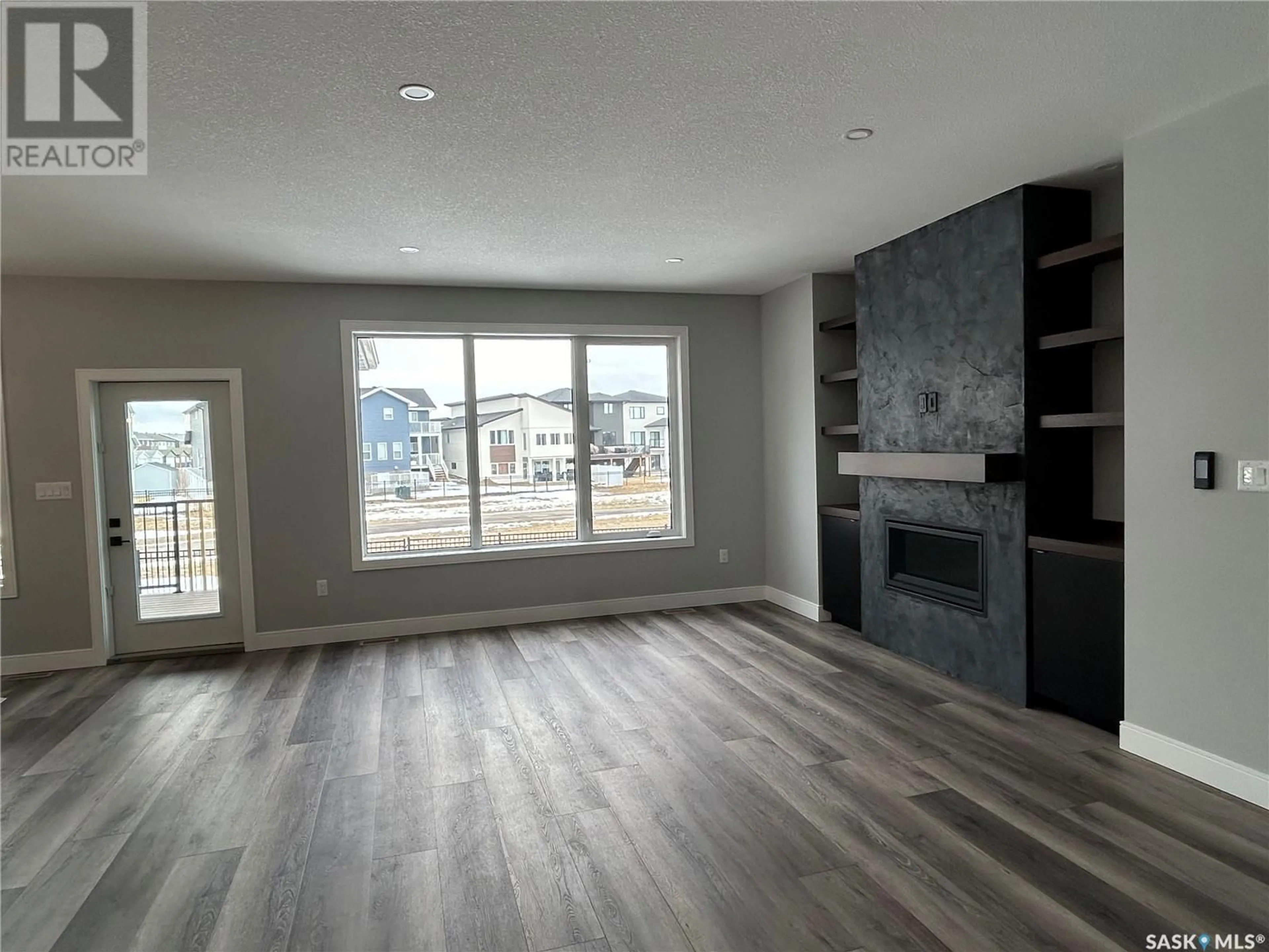 A pic of a room, wood floors for 5218 E Green CRESCENT, Regina Saskatchewan S4V3S9