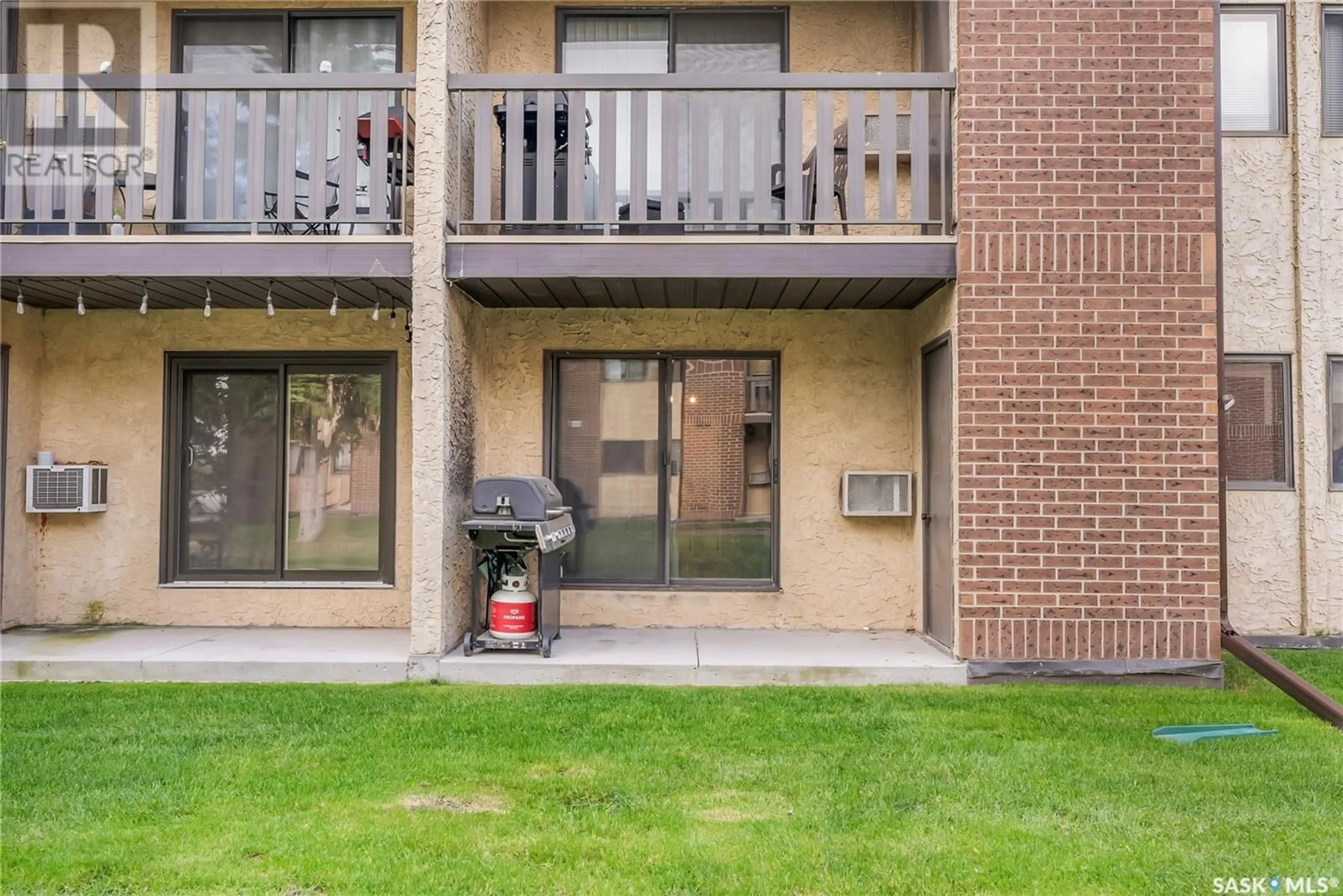 Patio, the front or back of building for 109 403 TAIT COURT, Saskatoon Saskatchewan S7H5L3