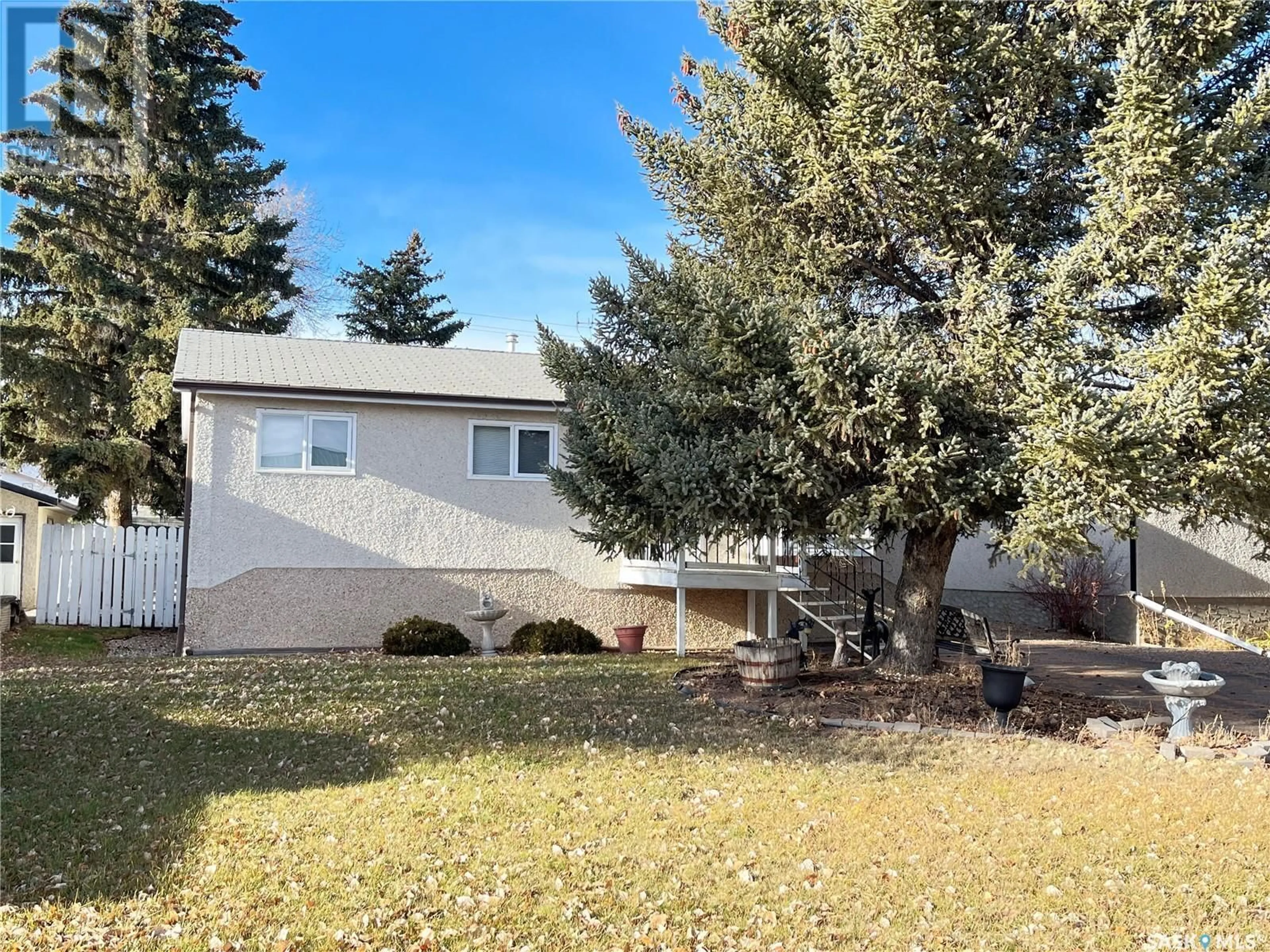 Frontside or backside of a home, the fenced backyard for 109 Griffin STREET, Maple Creek Saskatchewan S0N1N0