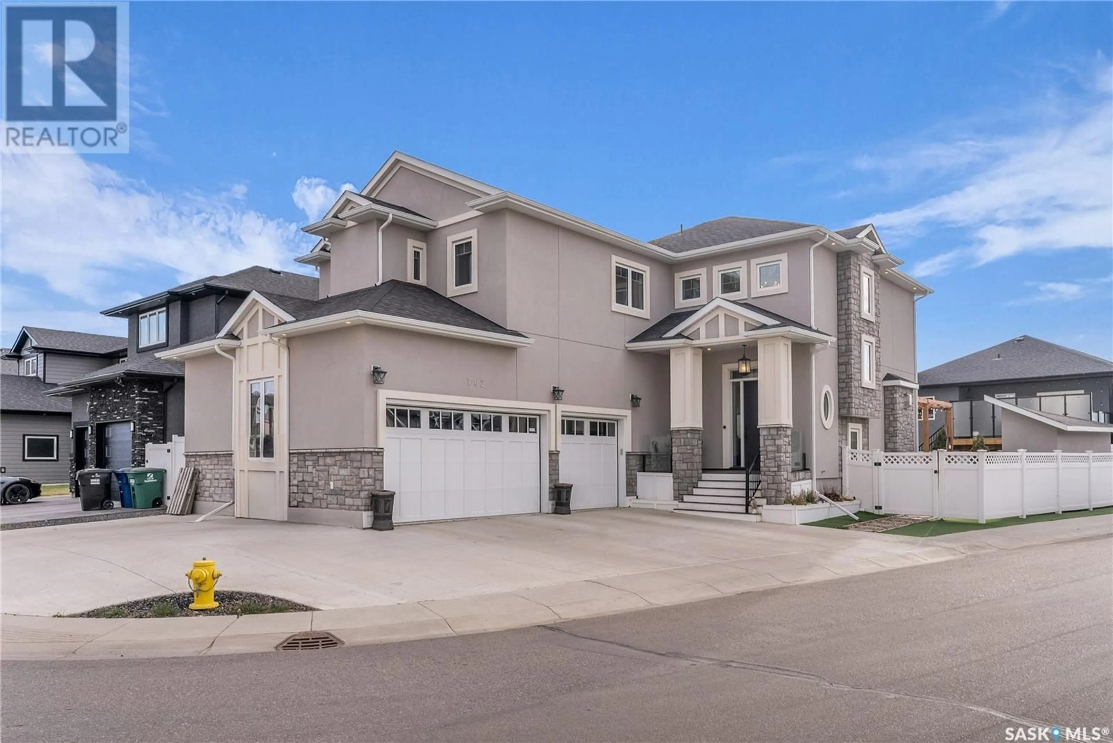 Frontside or backside of a home, the street view for 702 Bolstad TURN, Saskatoon Saskatchewan S7W0Y2