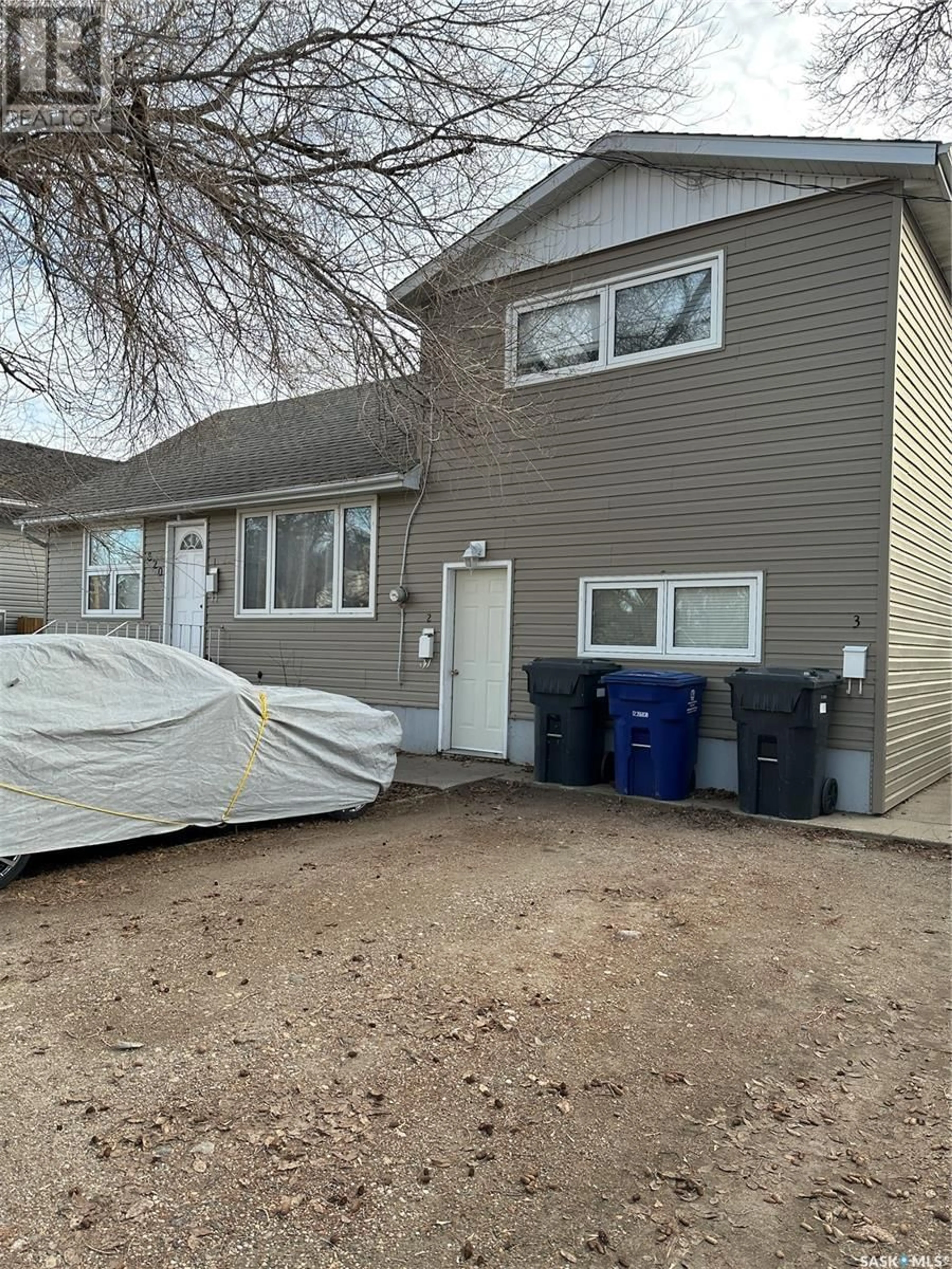 Frontside or backside of a home, the front or back of building for 820 Park AVENUE, Weyburn Saskatchewan S4H0K2