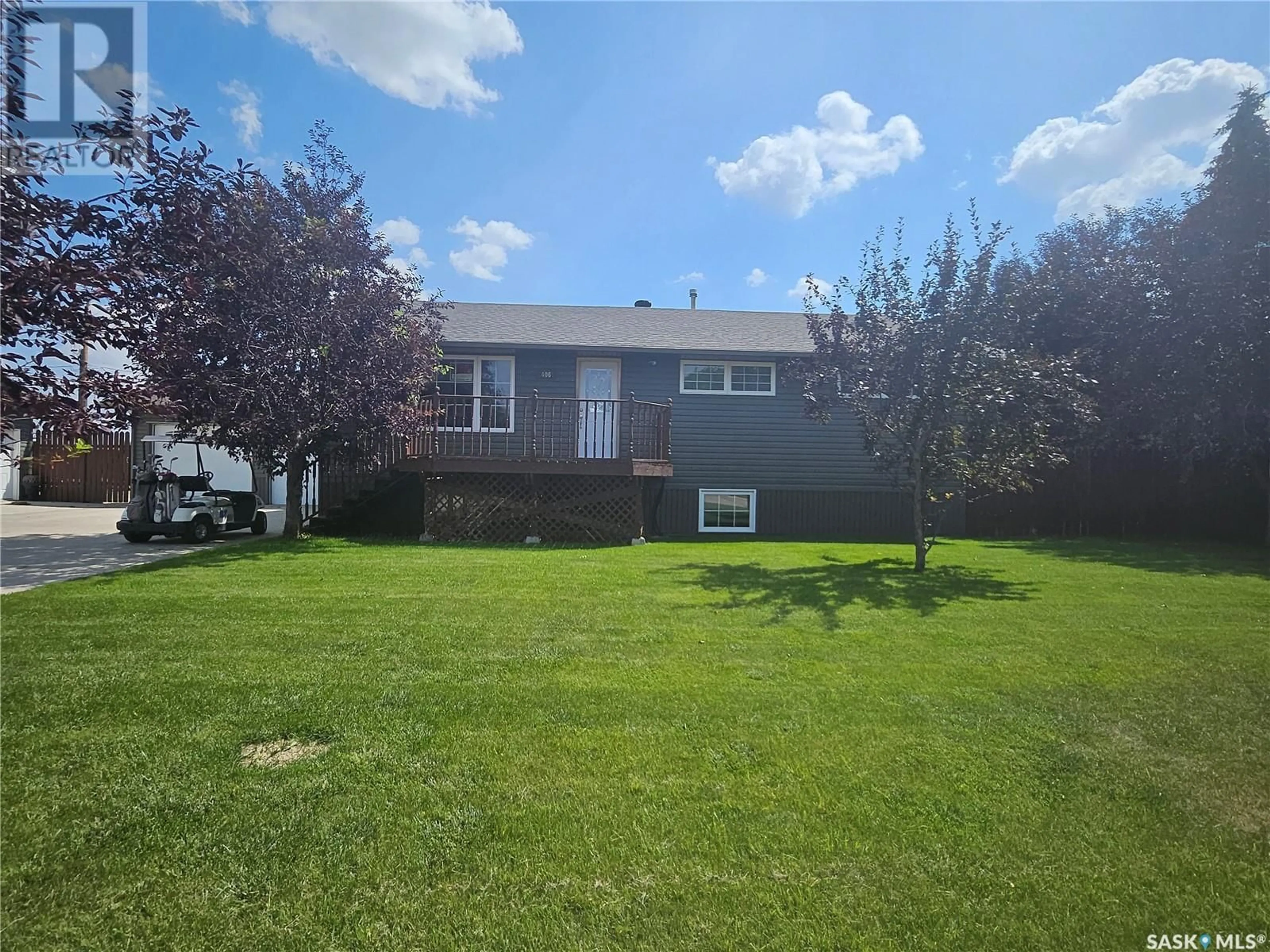 Frontside or backside of a home, the fenced backyard for 406 First AVENUE E, Lampman Saskatchewan S0C1N0