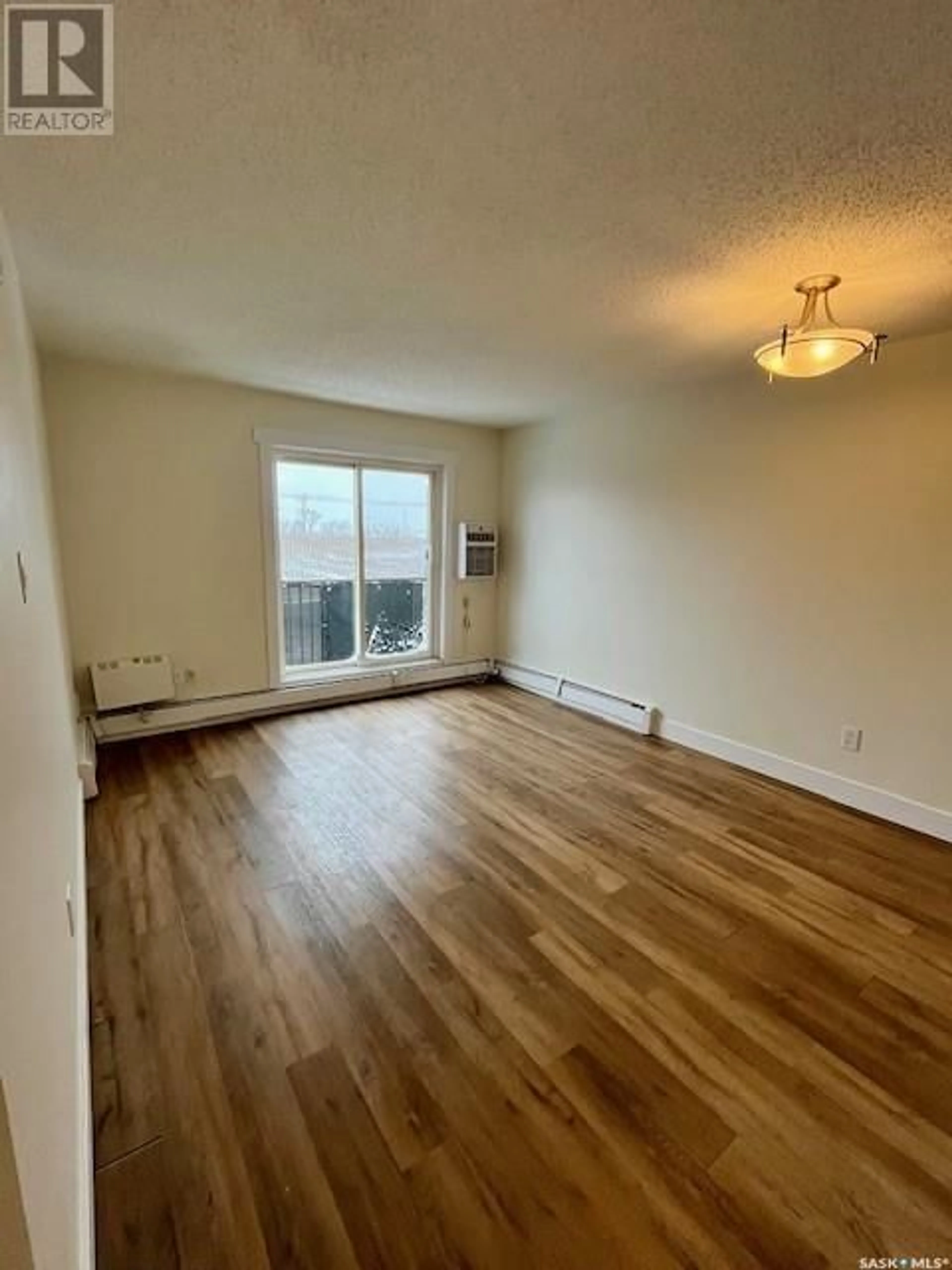 A pic of a room, wood floors for 404 105 110th STREET E, Saskatoon Saskatchewan S7N1S1