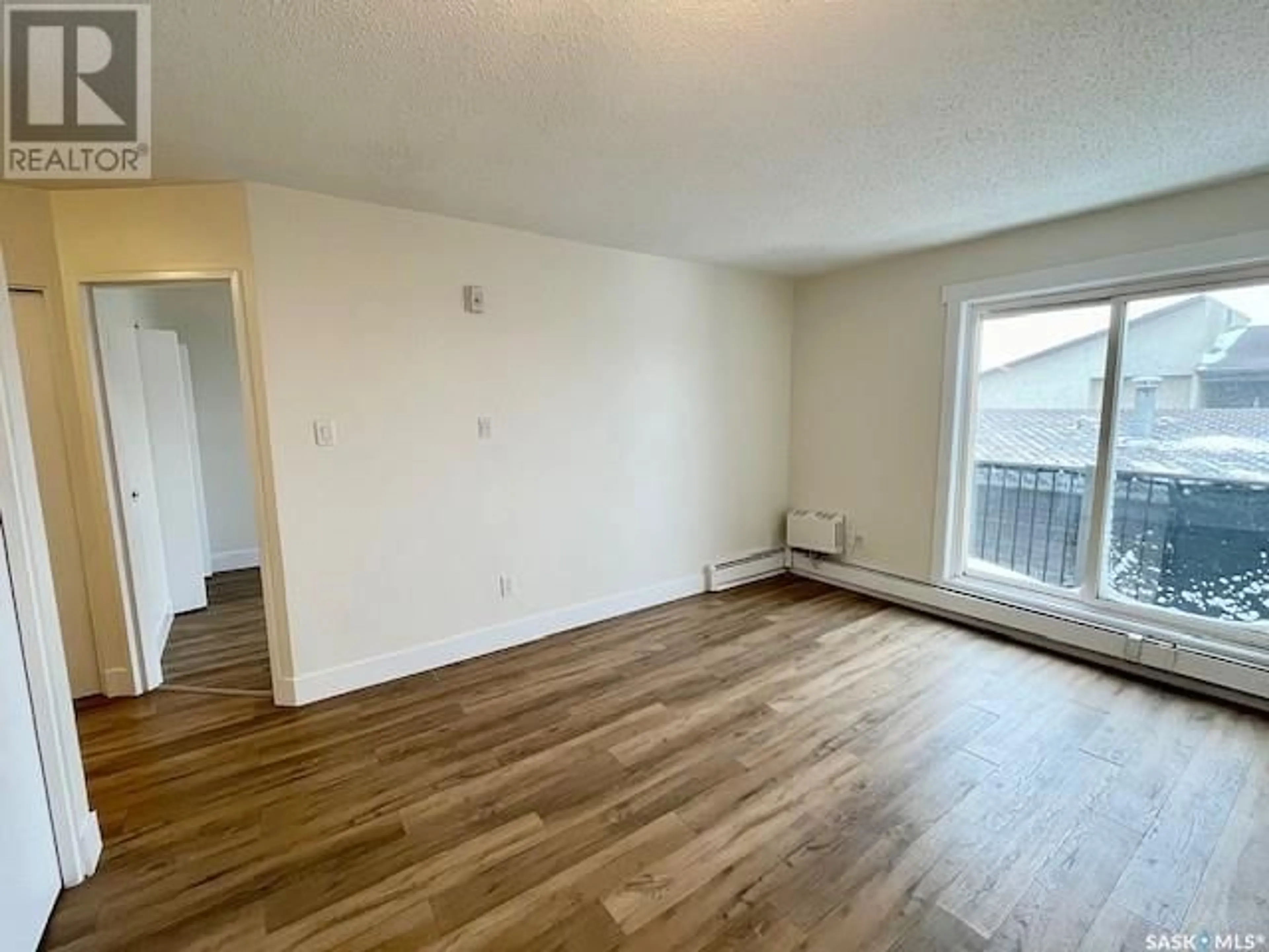 A pic of a room, wood floors for 404 105 110th STREET E, Saskatoon Saskatchewan S7N1S1