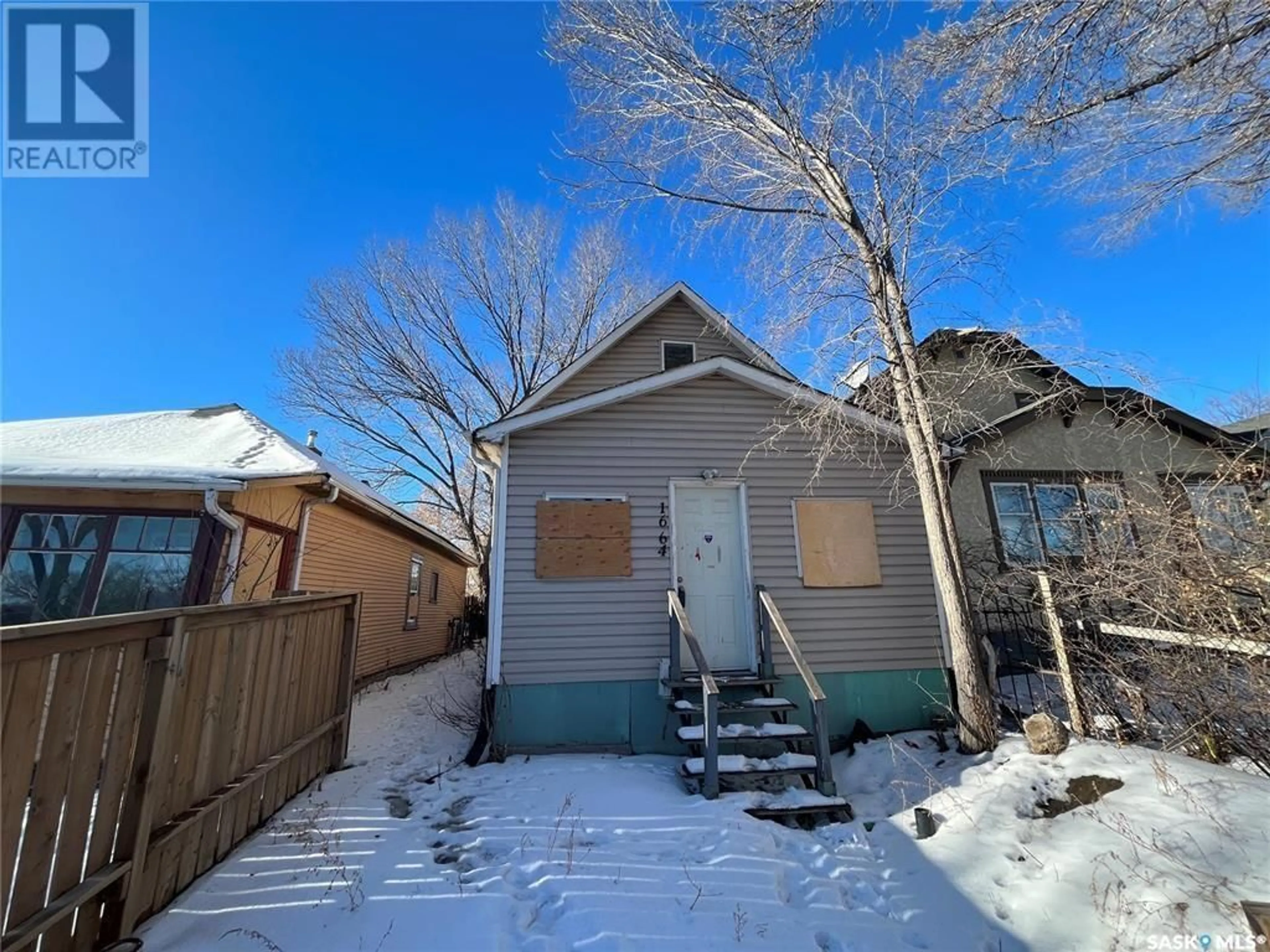 Frontside or backside of a home, the fenced backyard for 1664 Ottawa STREET, Regina Saskatchewan S4P1N9