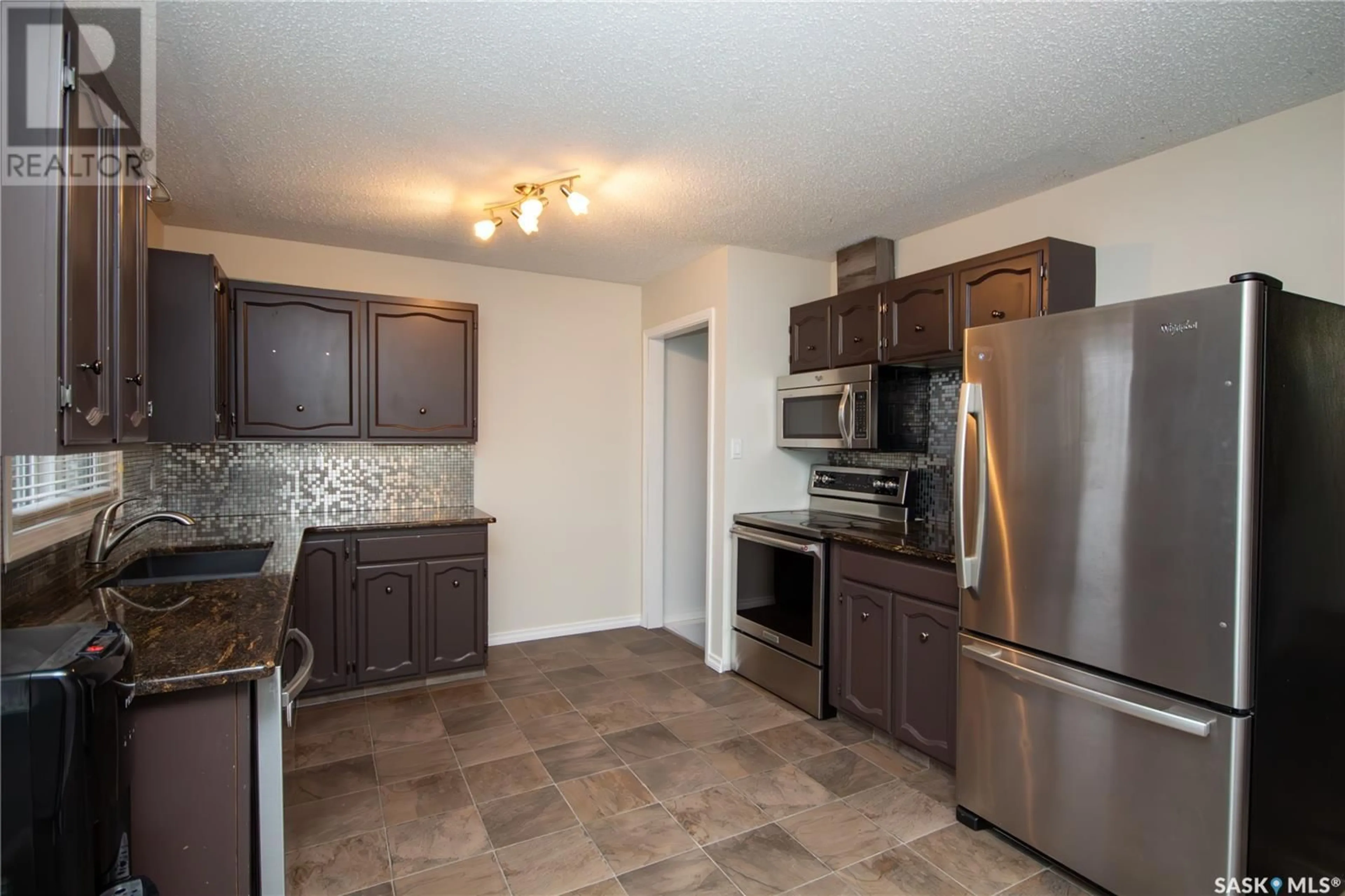 Standard kitchen, wood floors, cottage for 8908 Abbott AVENUE, North Battleford Saskatchewan S9A3H6