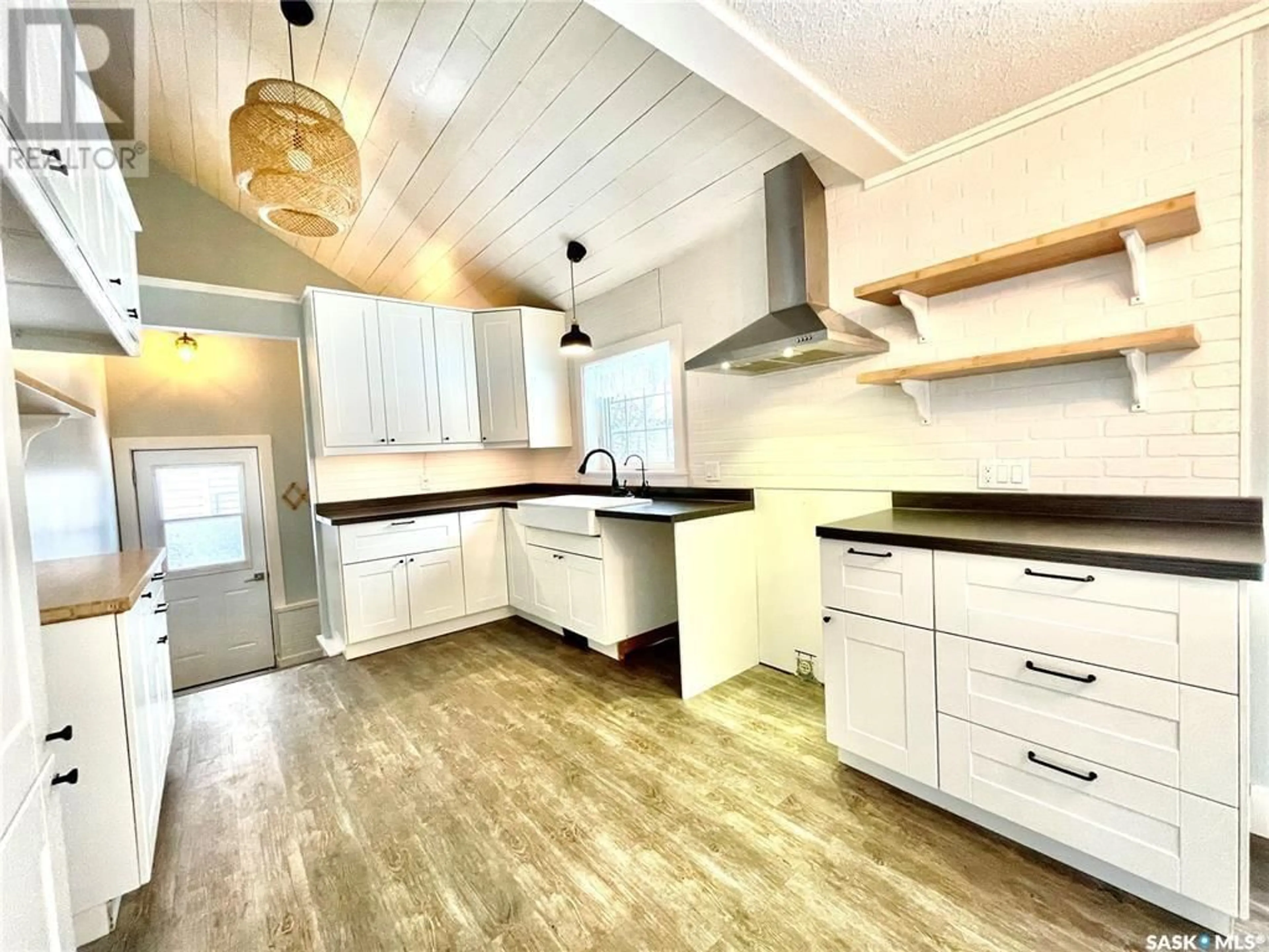 Open concept kitchen, wood/laminate floor for 137 1ST STREET, Carrot River Saskatchewan S0E0L0