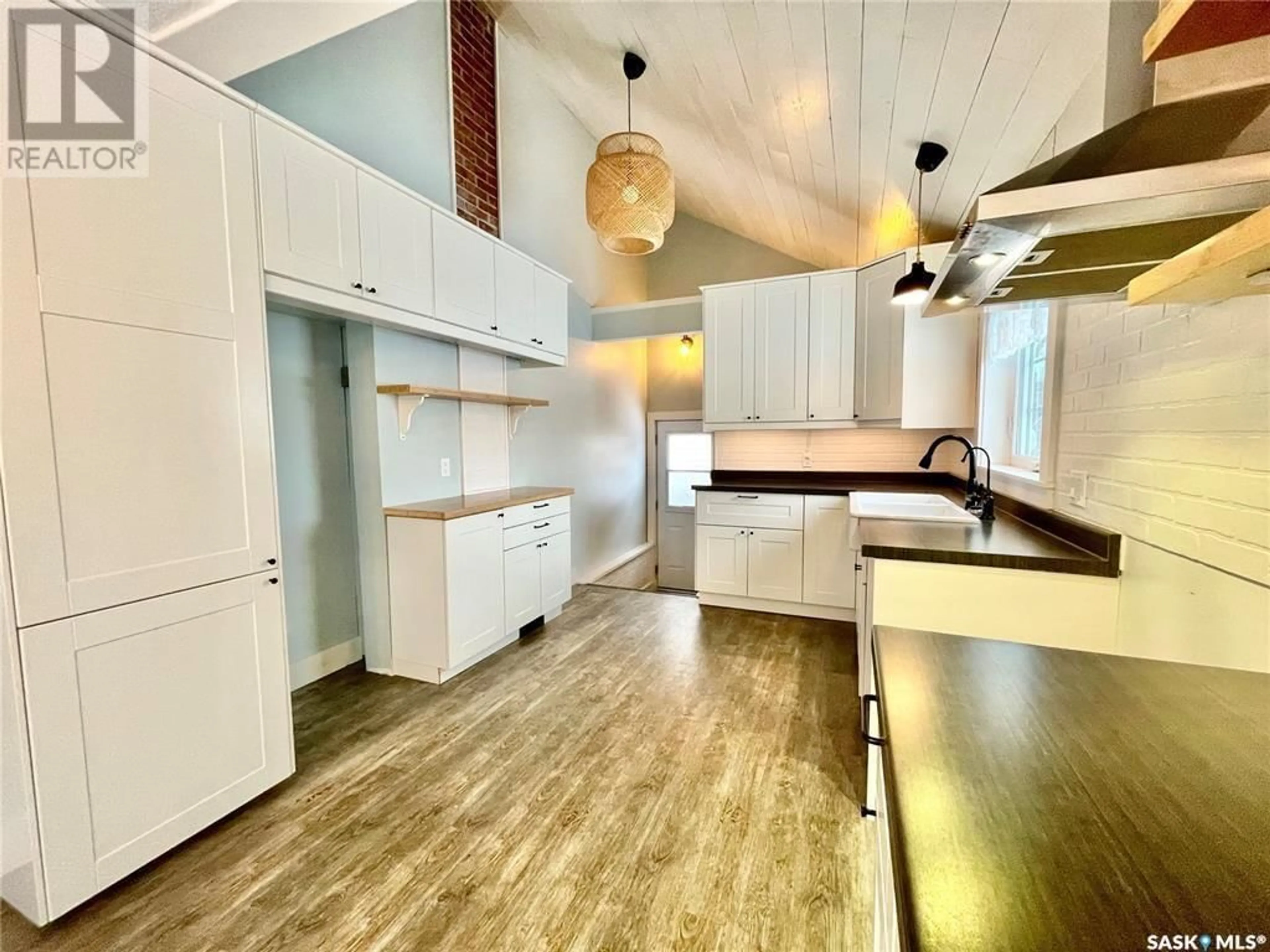 Open concept kitchen, wood/laminate floor for 137 1ST STREET, Carrot River Saskatchewan S0E0L0