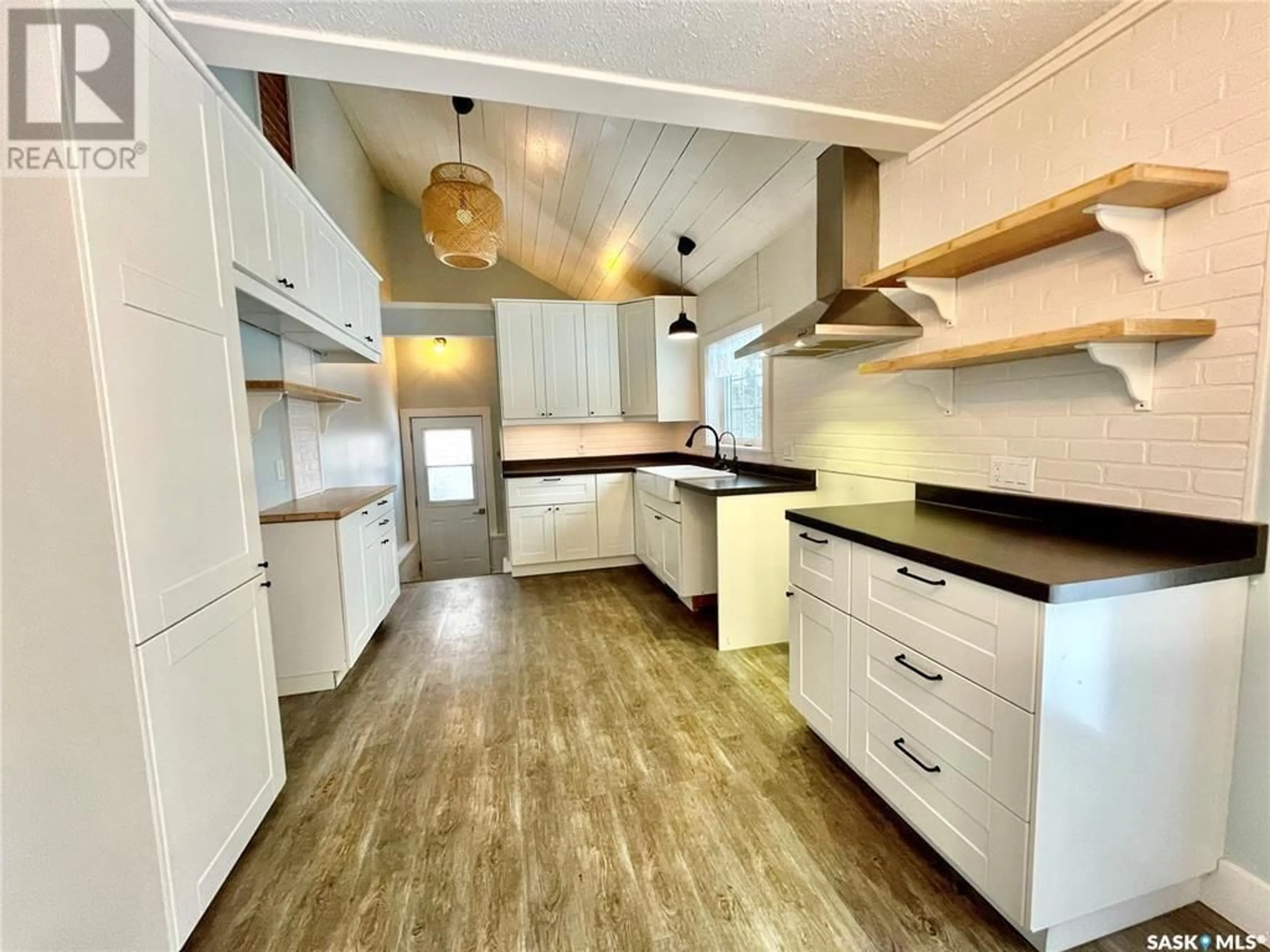 Open concept kitchen, wood/laminate floor for 137 1ST STREET, Carrot River Saskatchewan S0E0L0