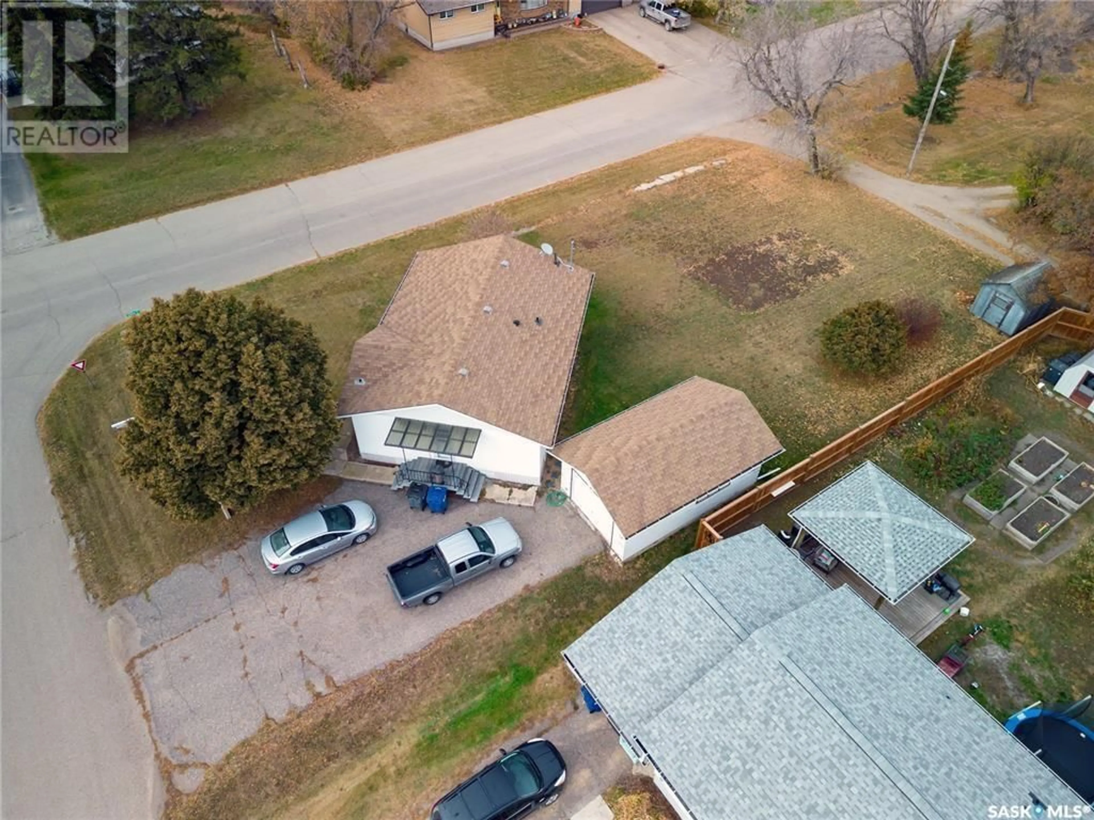 Frontside or backside of a home, the fenced backyard for 701 4TH AVENUE, Raymore Saskatchewan S0A3J0