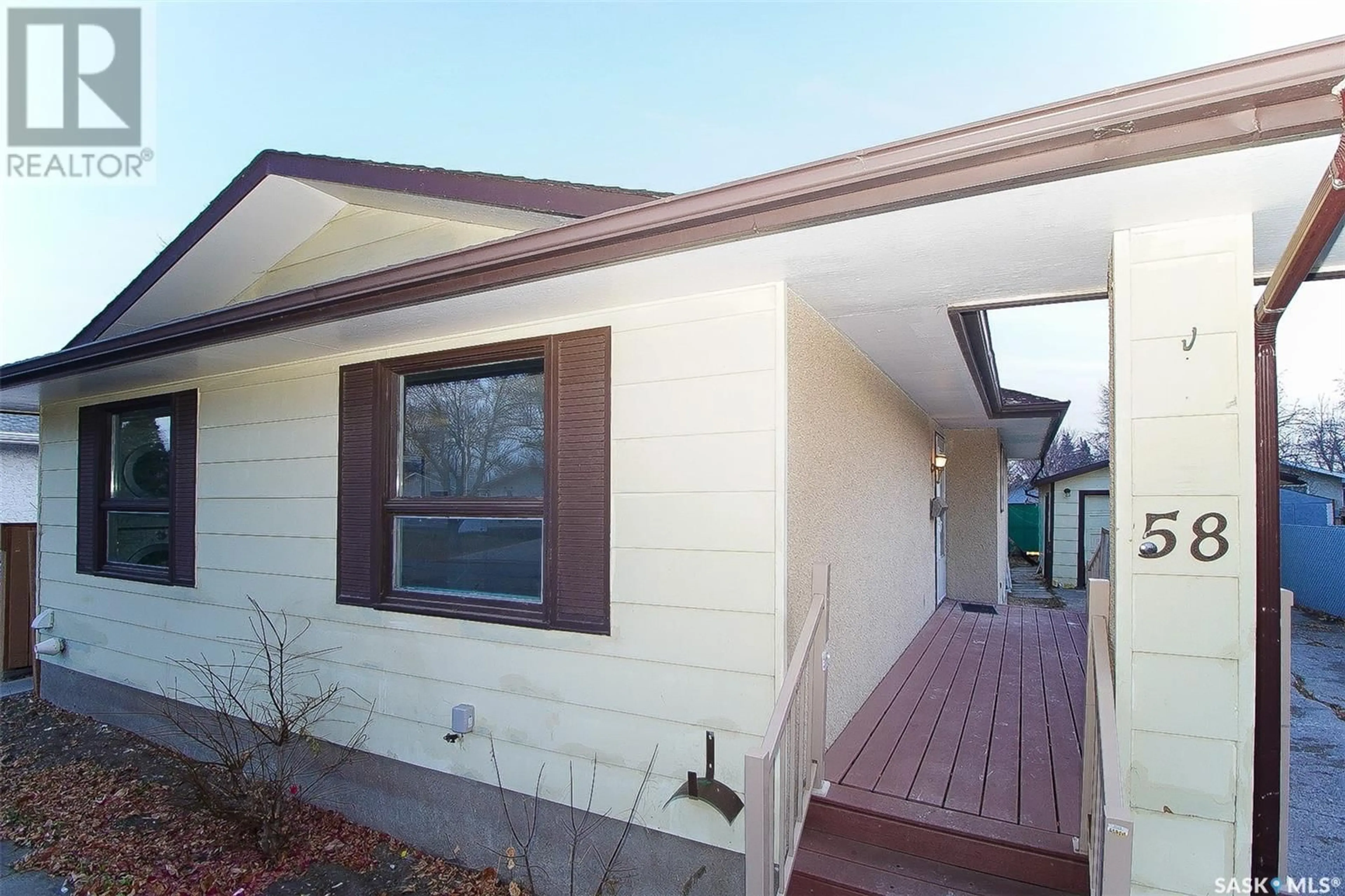 Frontside or backside of a home, the front or back of building for 58 HOOPER BAY, Regina Saskatchewan S4N4V9