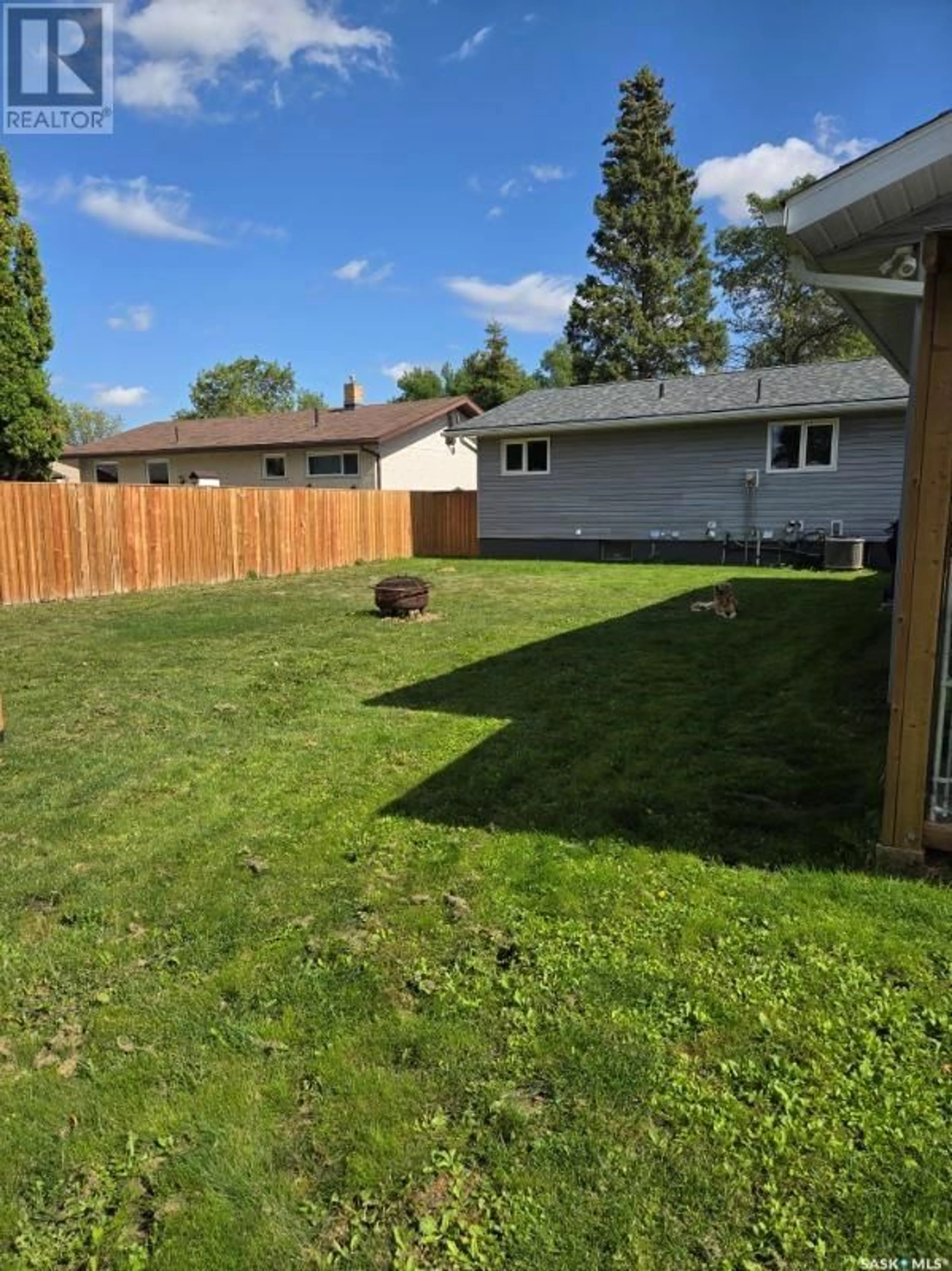 Frontside or backside of a home, the fenced backyard for 142 Circlebrooke DRIVE, Yorkton Saskatchewan S3N2S4