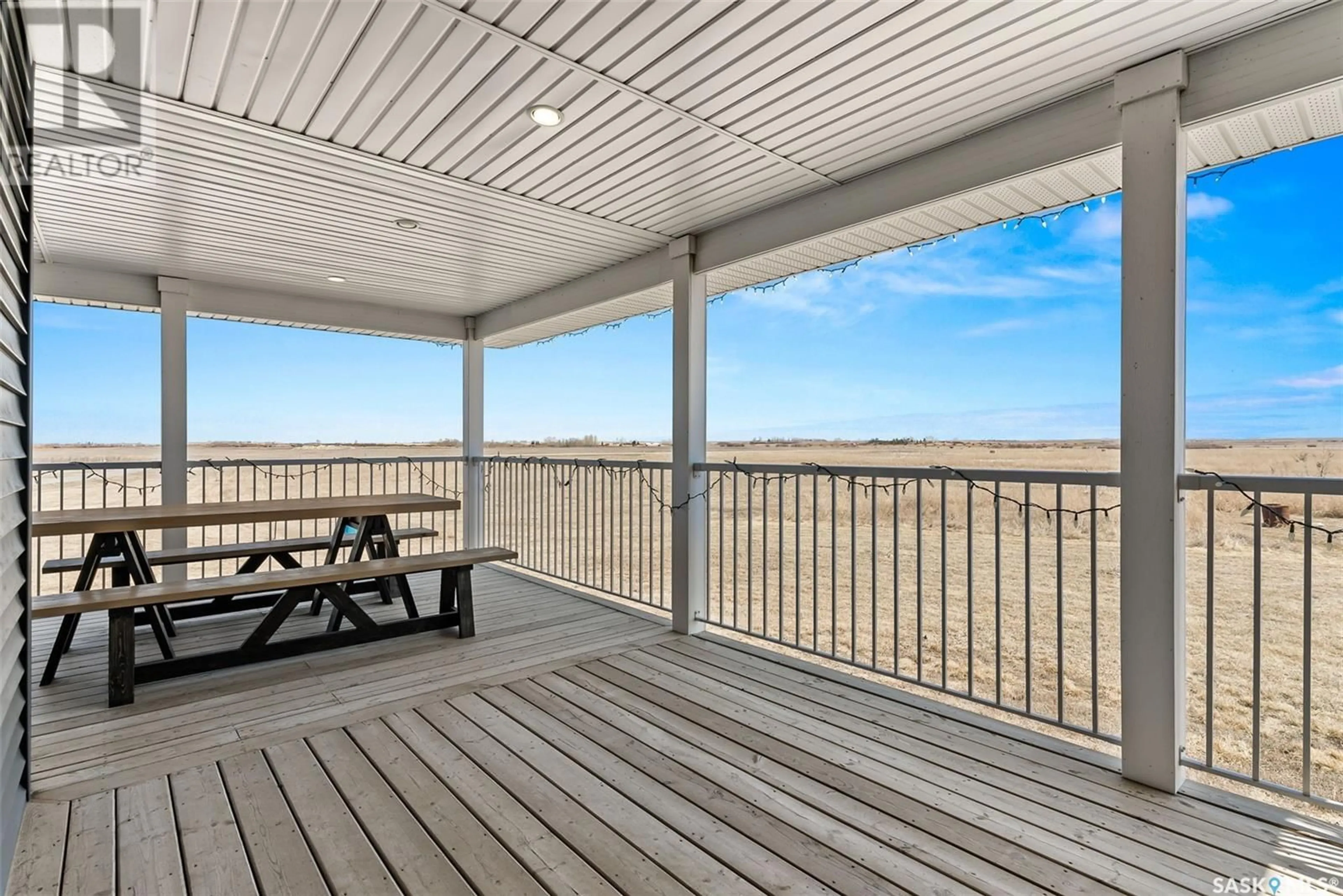 Patio, the fenced backyard for The Monk Acreage, Edenwold Rm No. 158 Saskatchewan S4L5B1