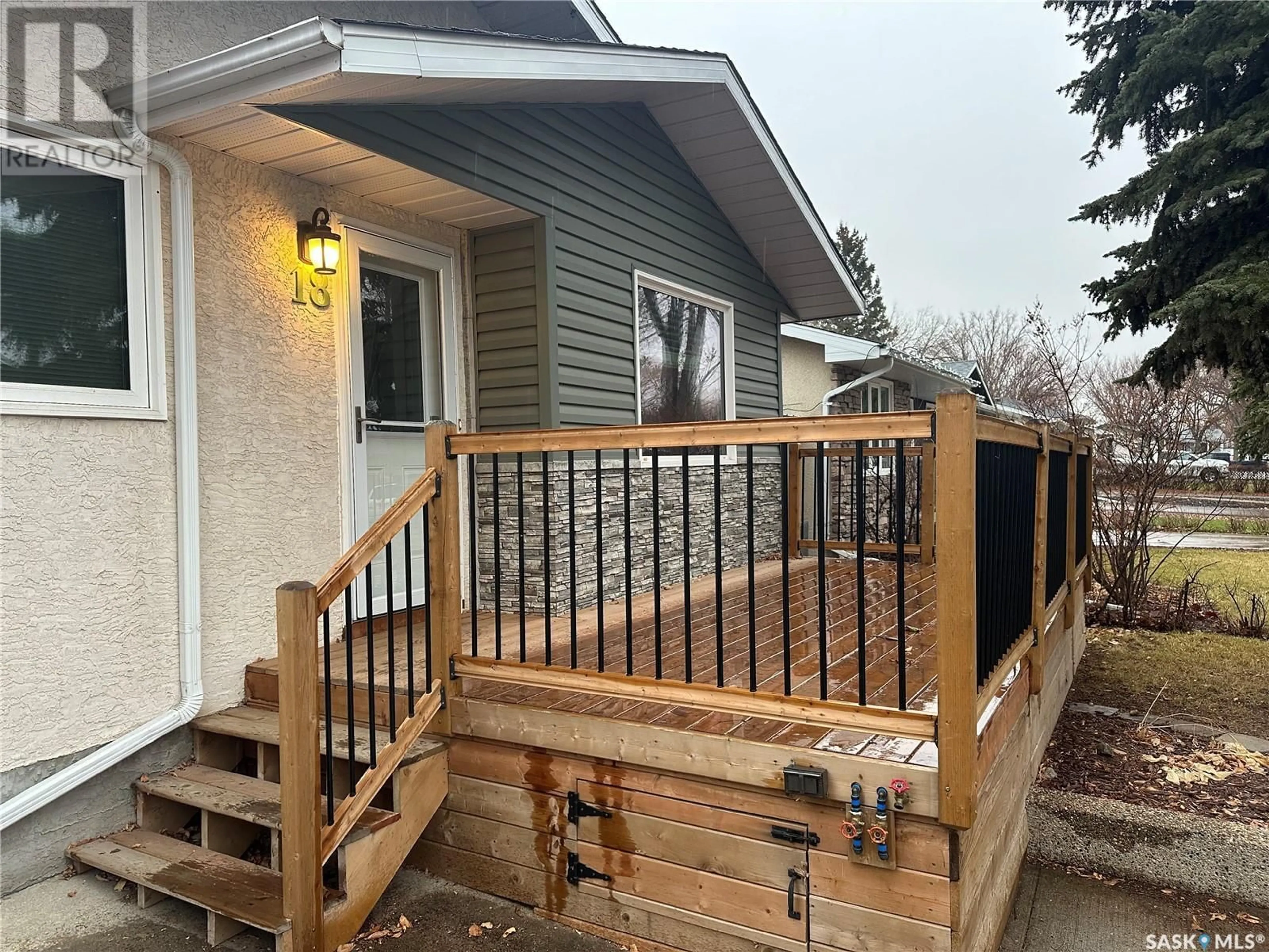 Frontside or backside of a home, the fenced backyard for 18 Young CRESCENT, Regina Saskatchewan S4N4K8