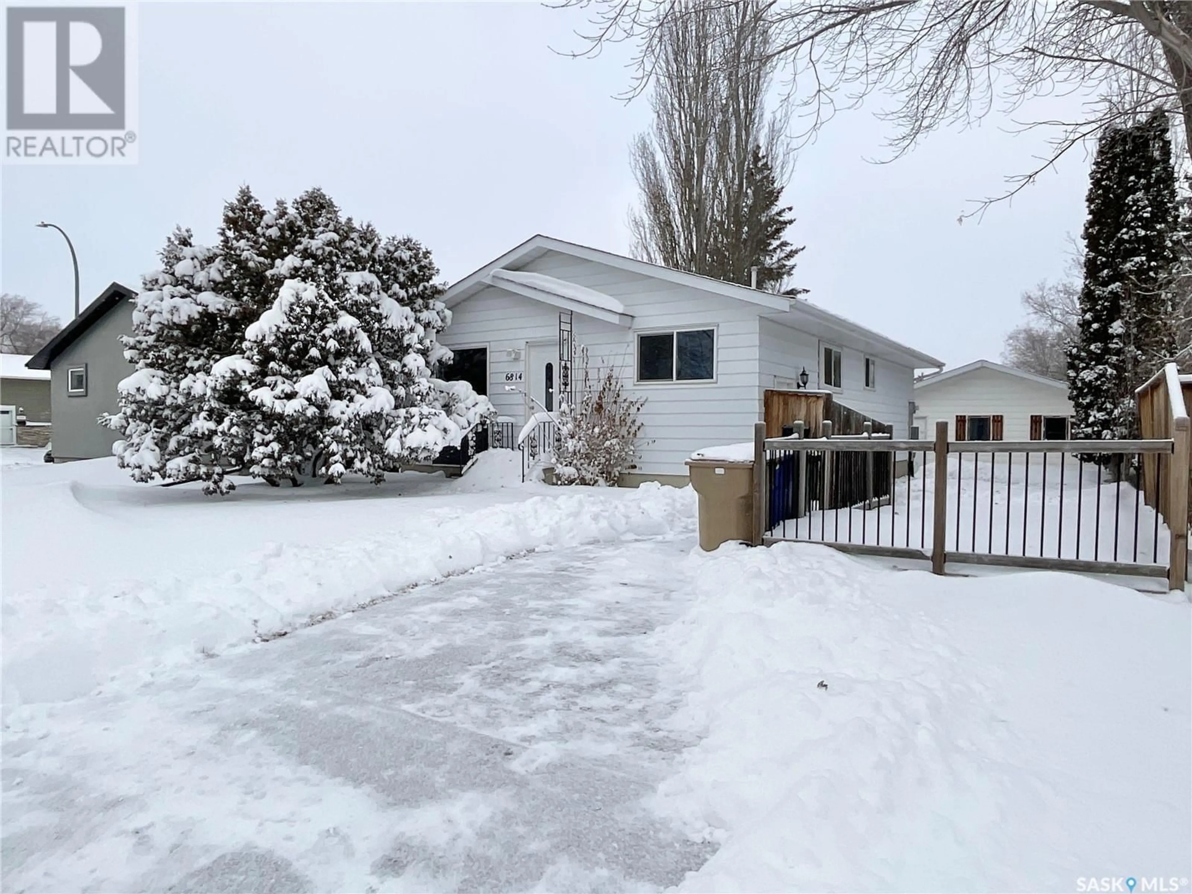 Frontside or backside of a home, the fenced backyard for 6814 1st AVENUE N, Regina Saskatchewan S4X1H9