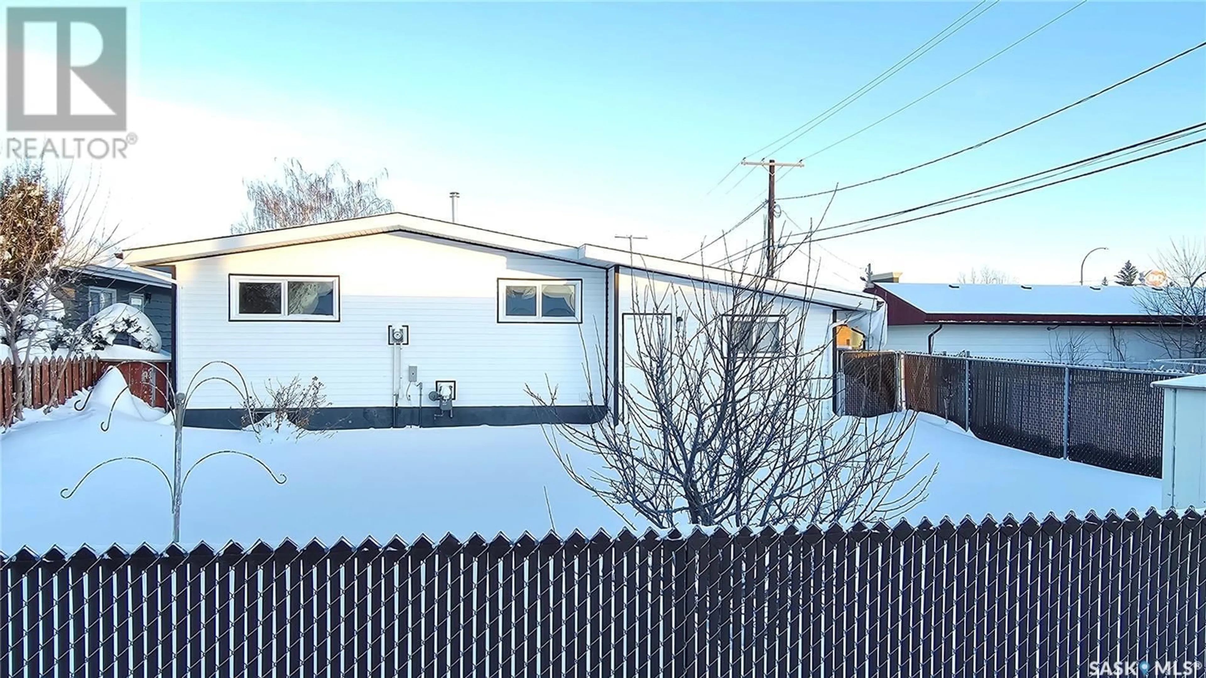 Frontside or backside of a home, the fenced backyard for 815 16th STREET, Humboldt Saskatchewan S0K2A0