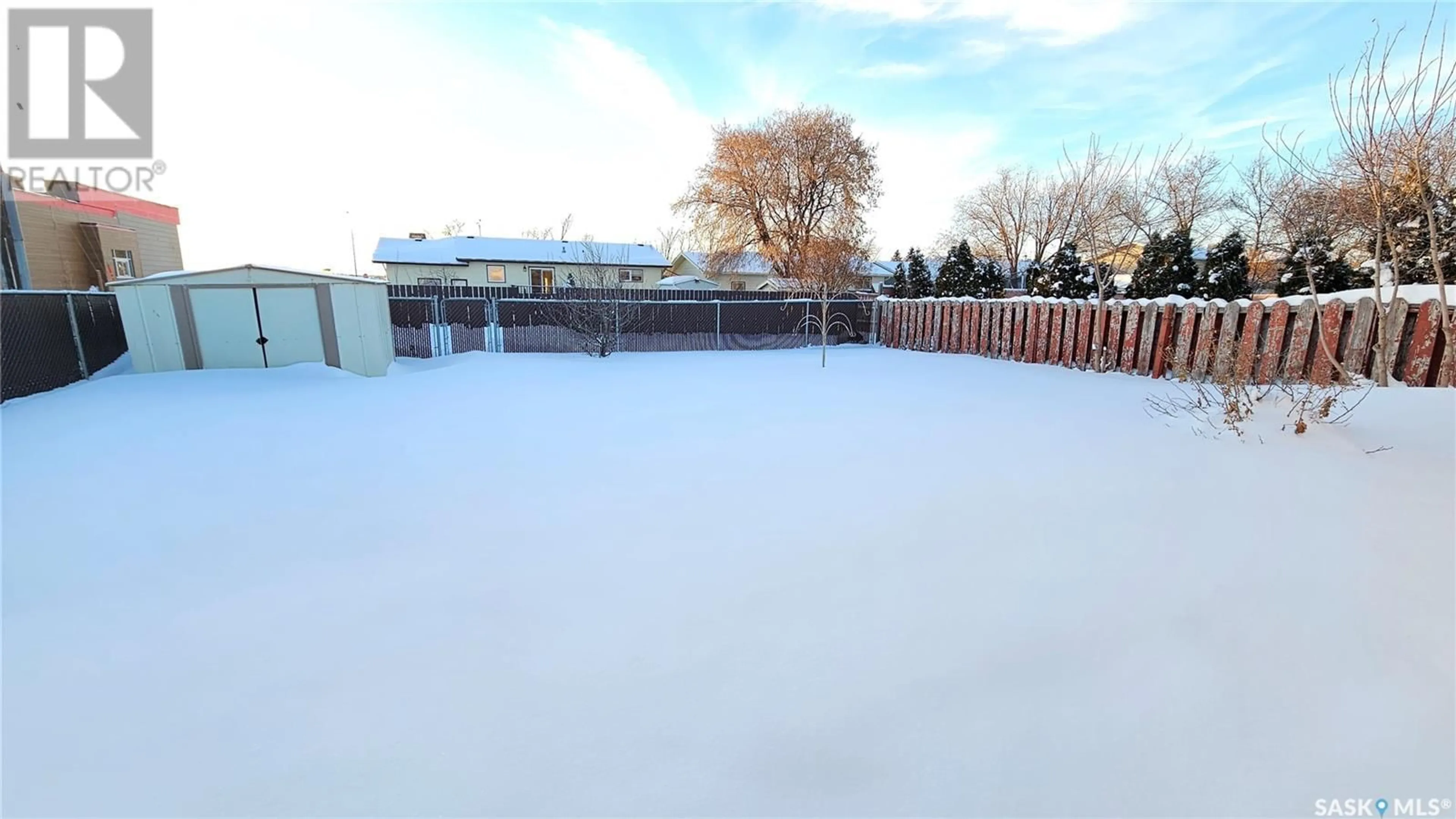 A pic from exterior of the house or condo, the fenced backyard for 815 16th STREET, Humboldt Saskatchewan S0K2A0