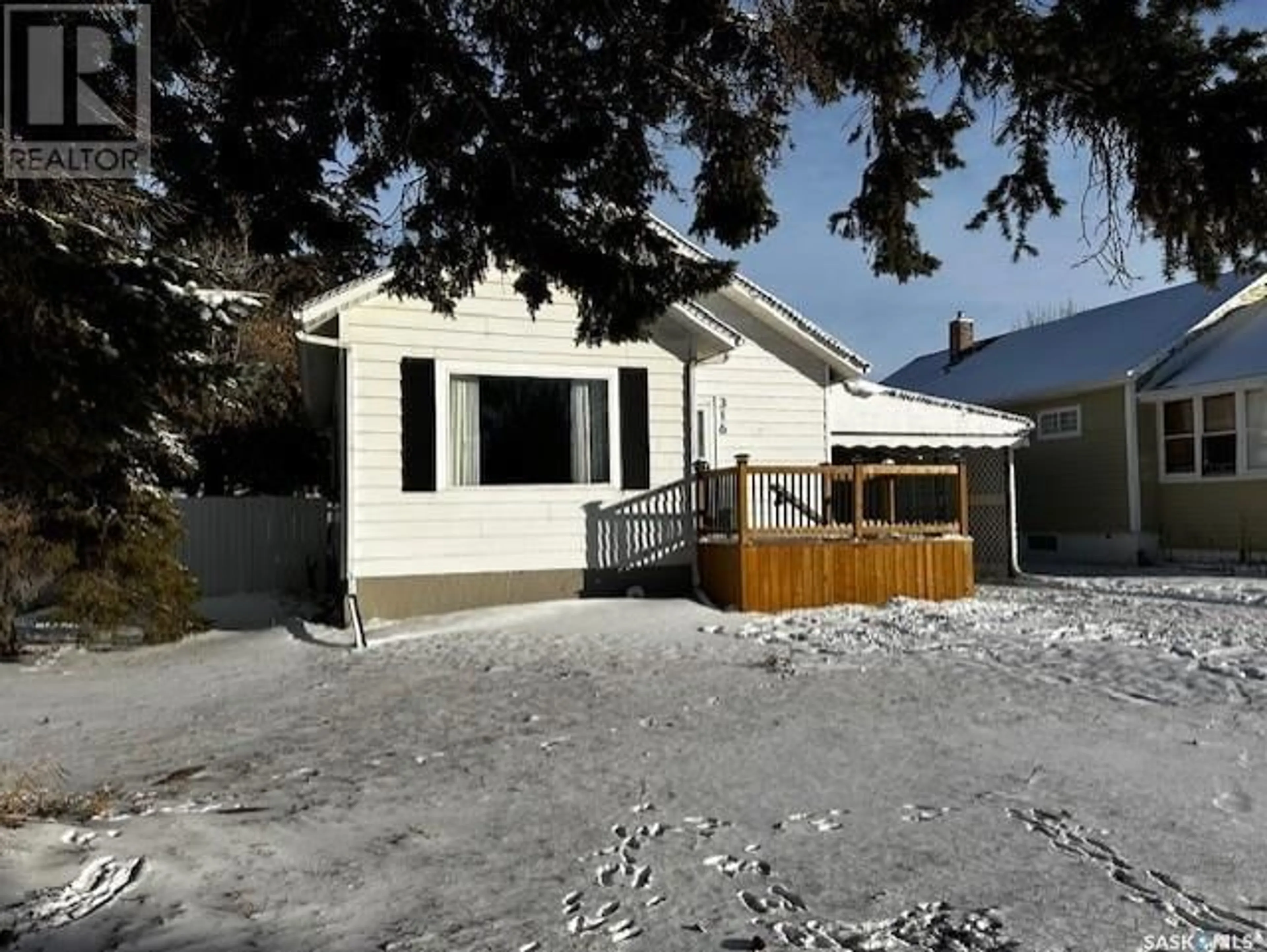 Frontside or backside of a home, the fenced backyard for 316 7th AVENUE W, Melville Saskatchewan S0A2P0