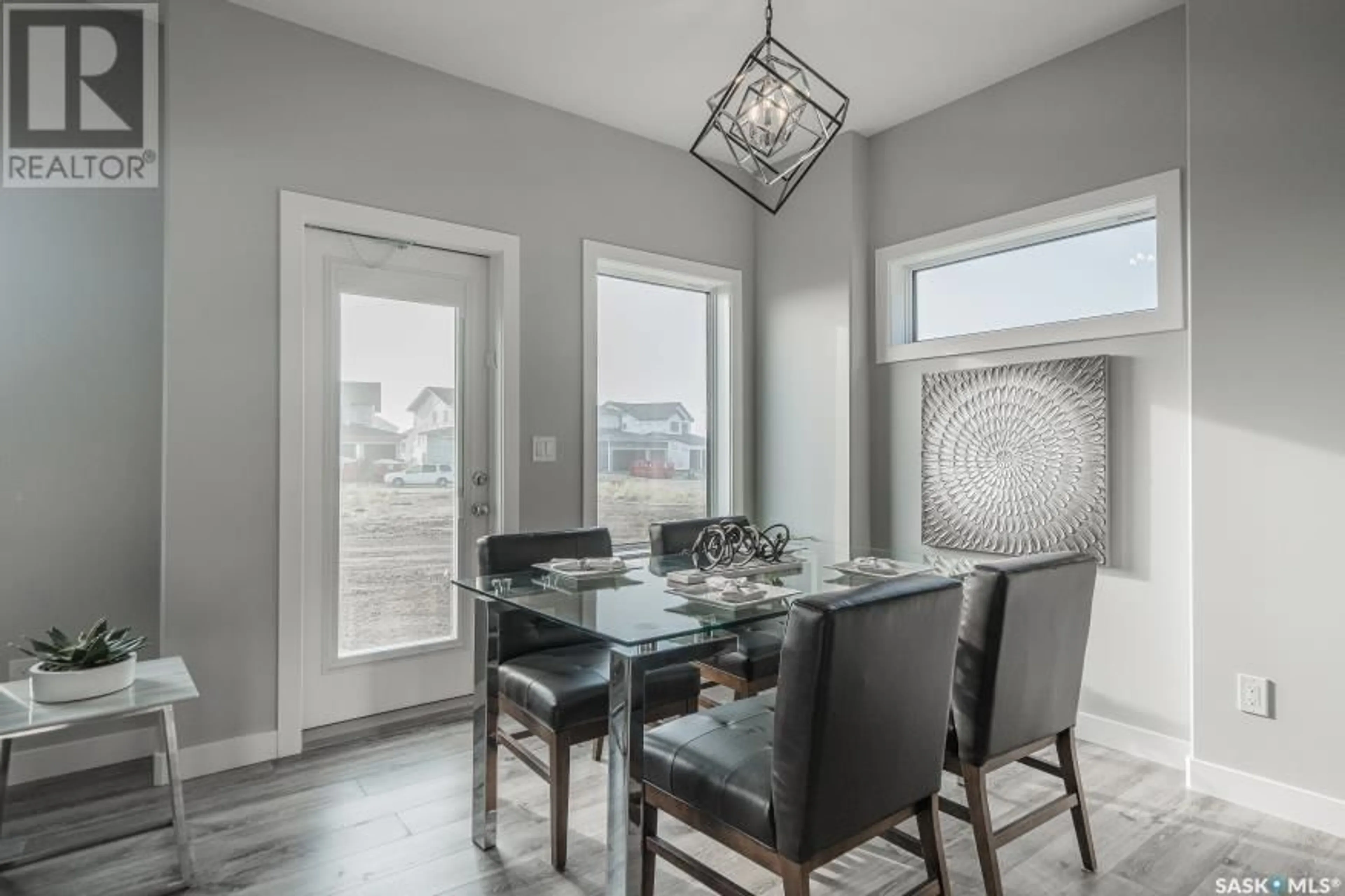 Dining room, wood floors, cottage for 113 Traeger COMMON, Saskatoon Saskatchewan S7V1R3