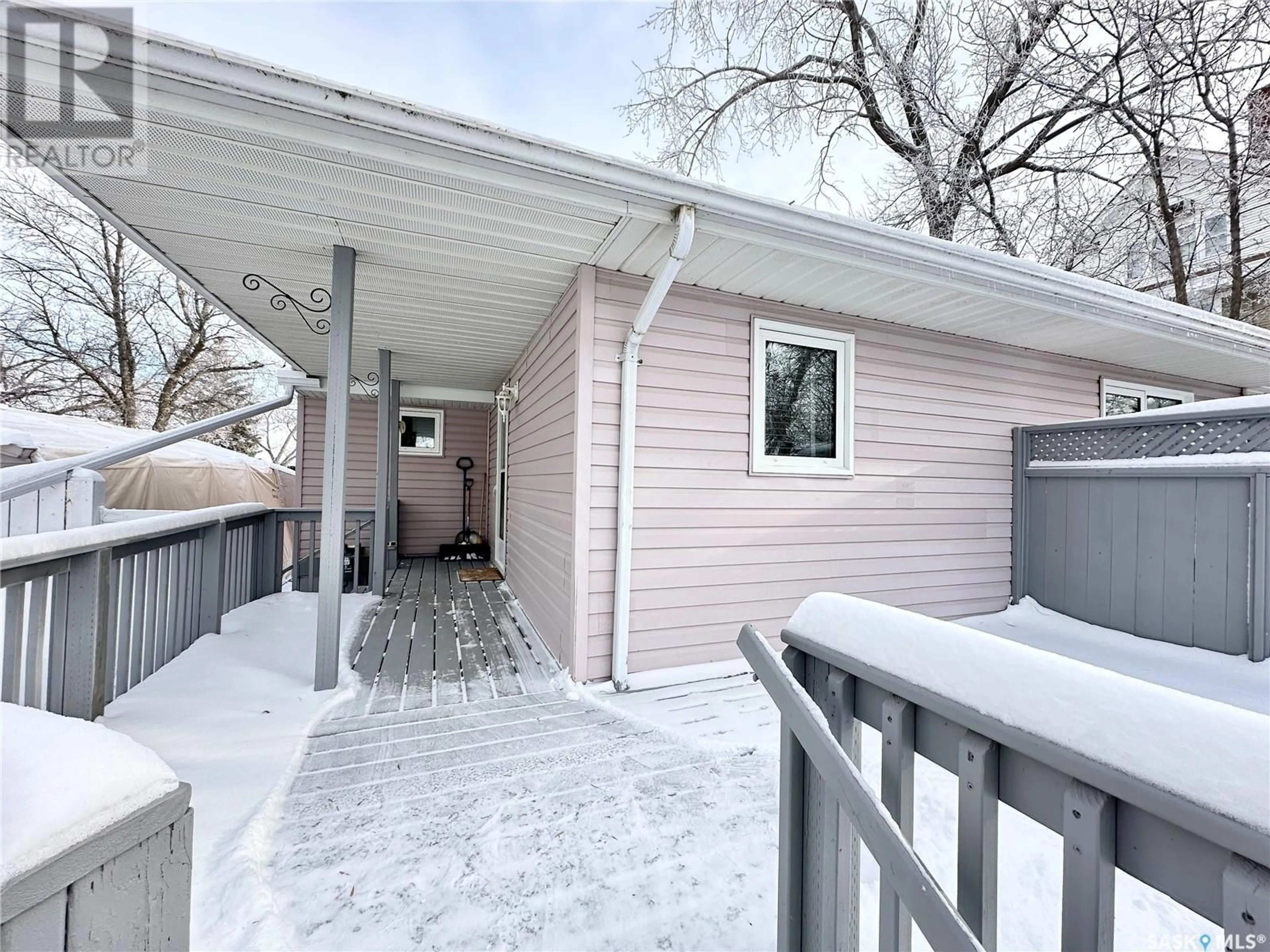 A pic from exterior of the house or condo, the fenced backyard for 811 4th STREET S, Weyburn Saskatchewan S4H2G4