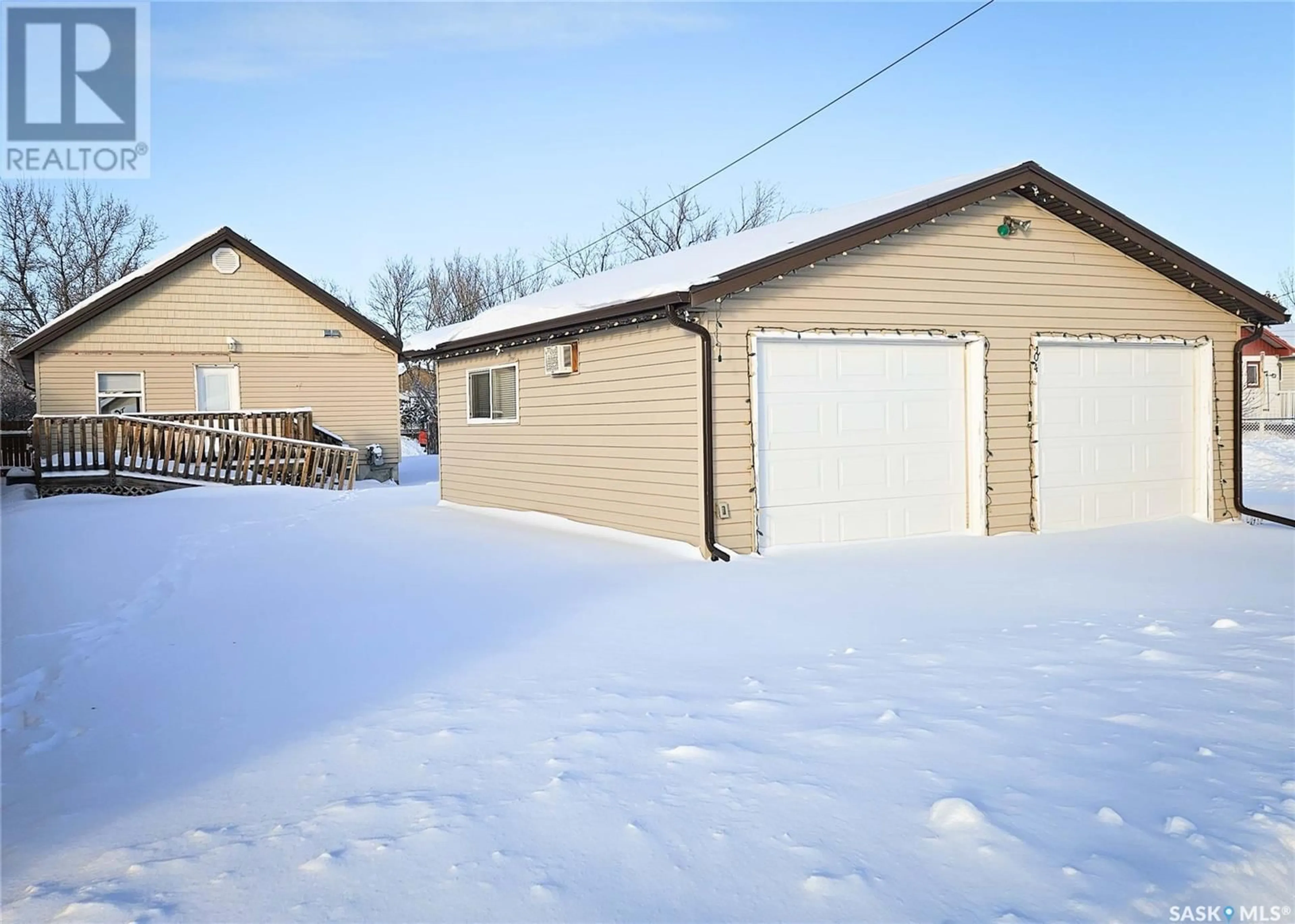 Frontside or backside of a home, the fenced backyard for 204 1st AVENUE E, Rosetown Saskatchewan S0L2V0