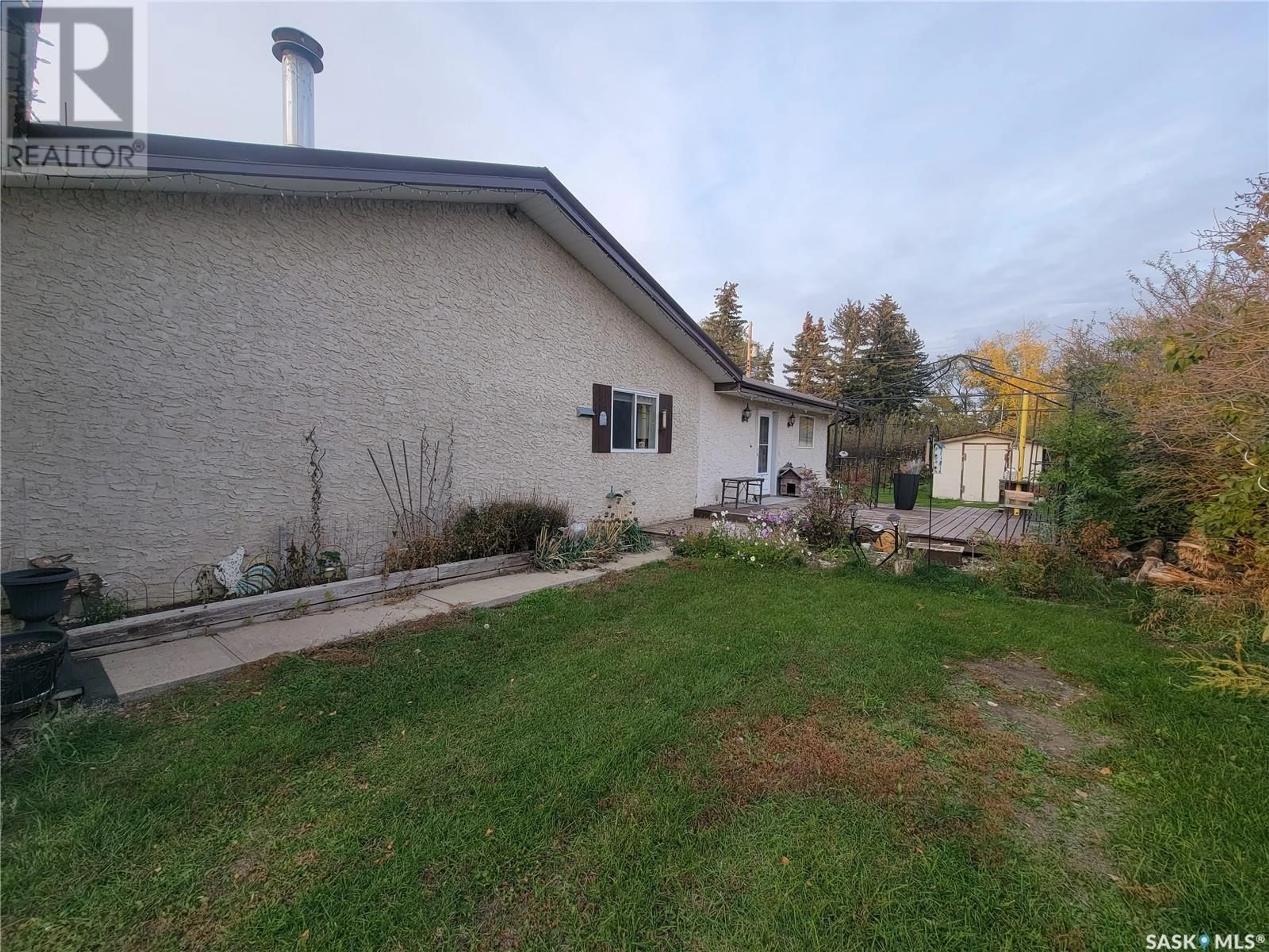 Frontside or backside of a home, the fenced backyard for 24 - 25 Leicester STREET, Evesham Saskatchewan S0L1B0