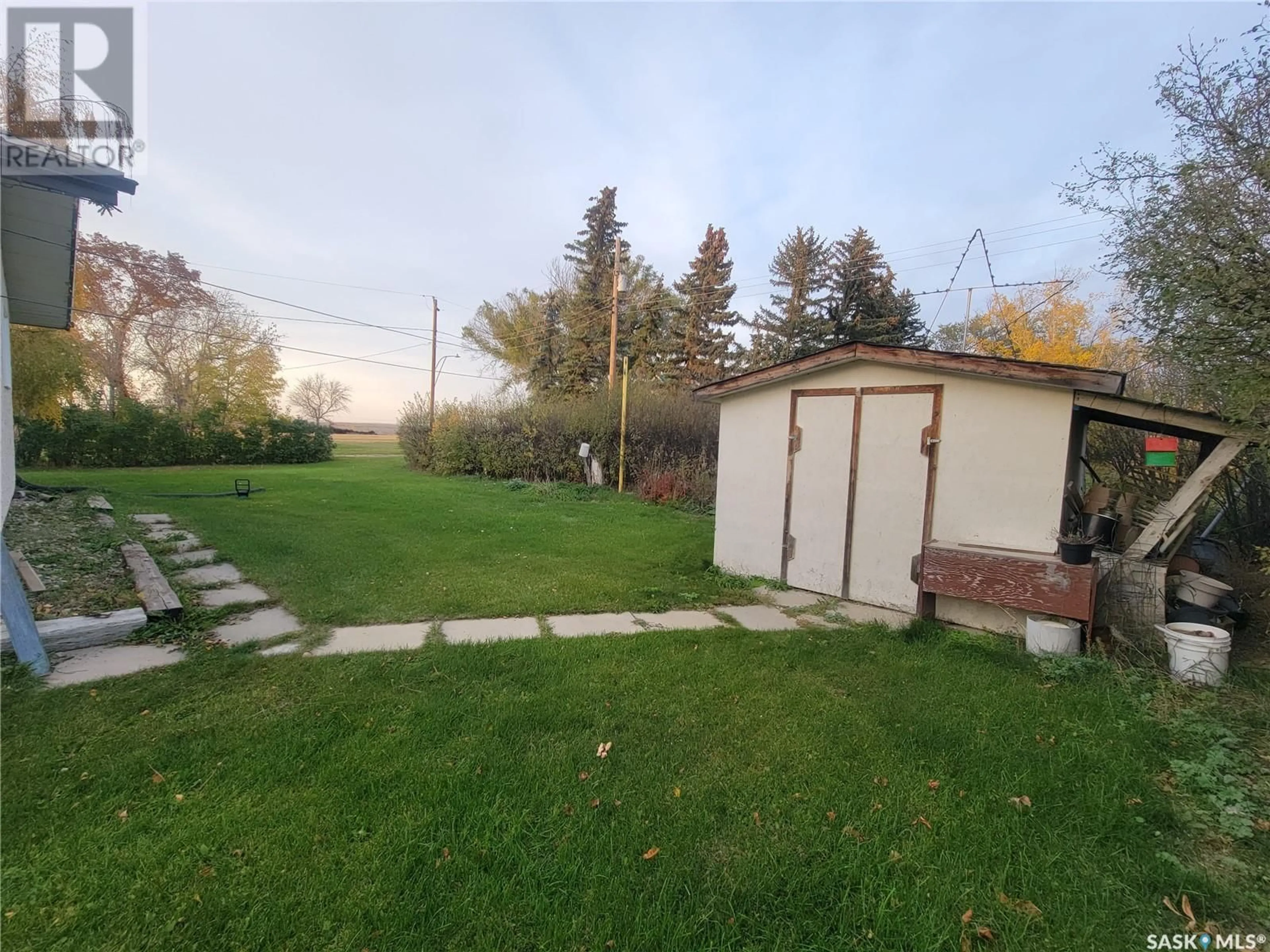 Patio, the fenced backyard for 24 - 25 Leicester STREET, Evesham Saskatchewan S0L1B0