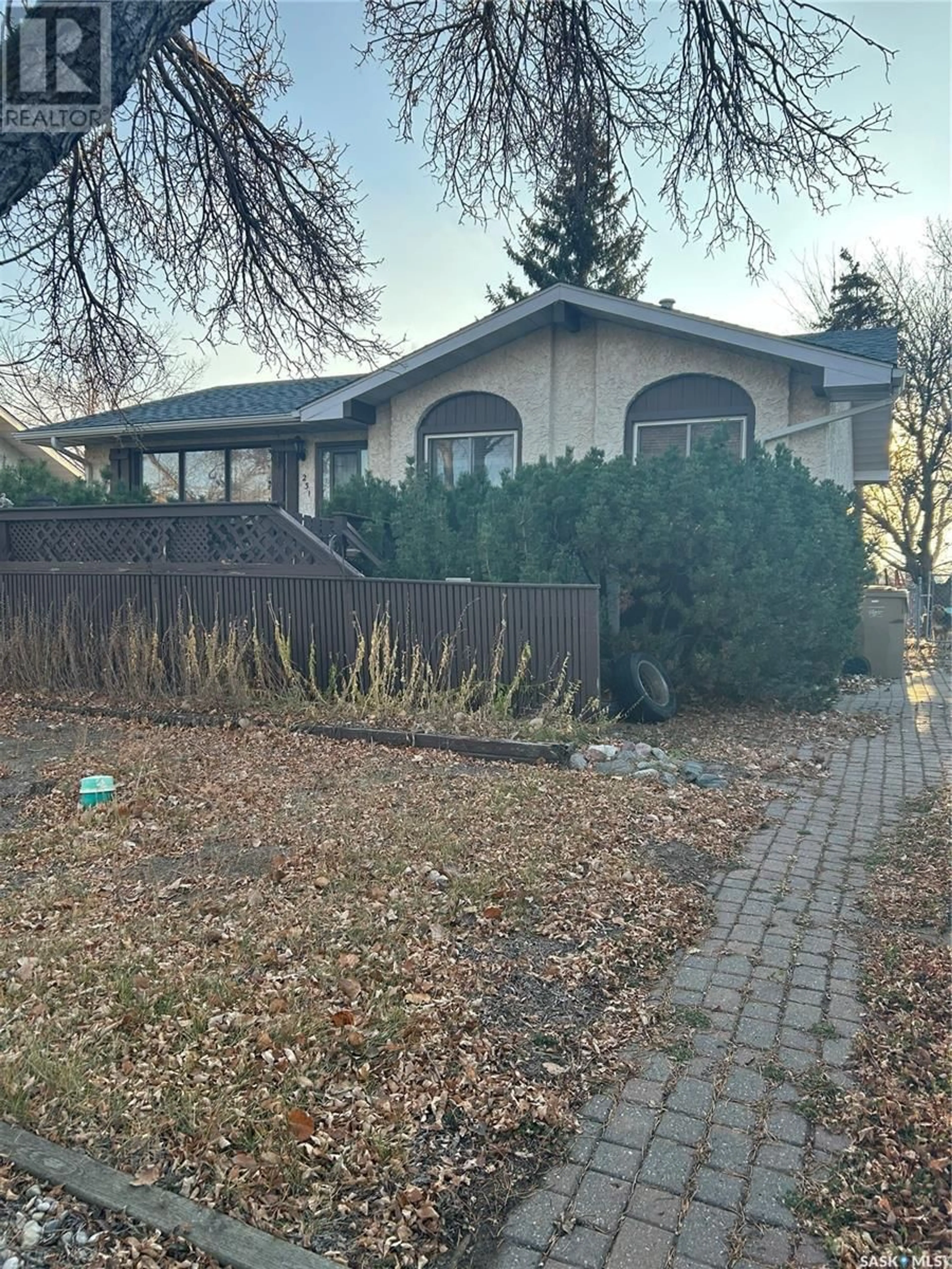 Frontside or backside of a home, the fenced backyard for 231 Church DRIVE, Regina Saskatchewan S4X1R8