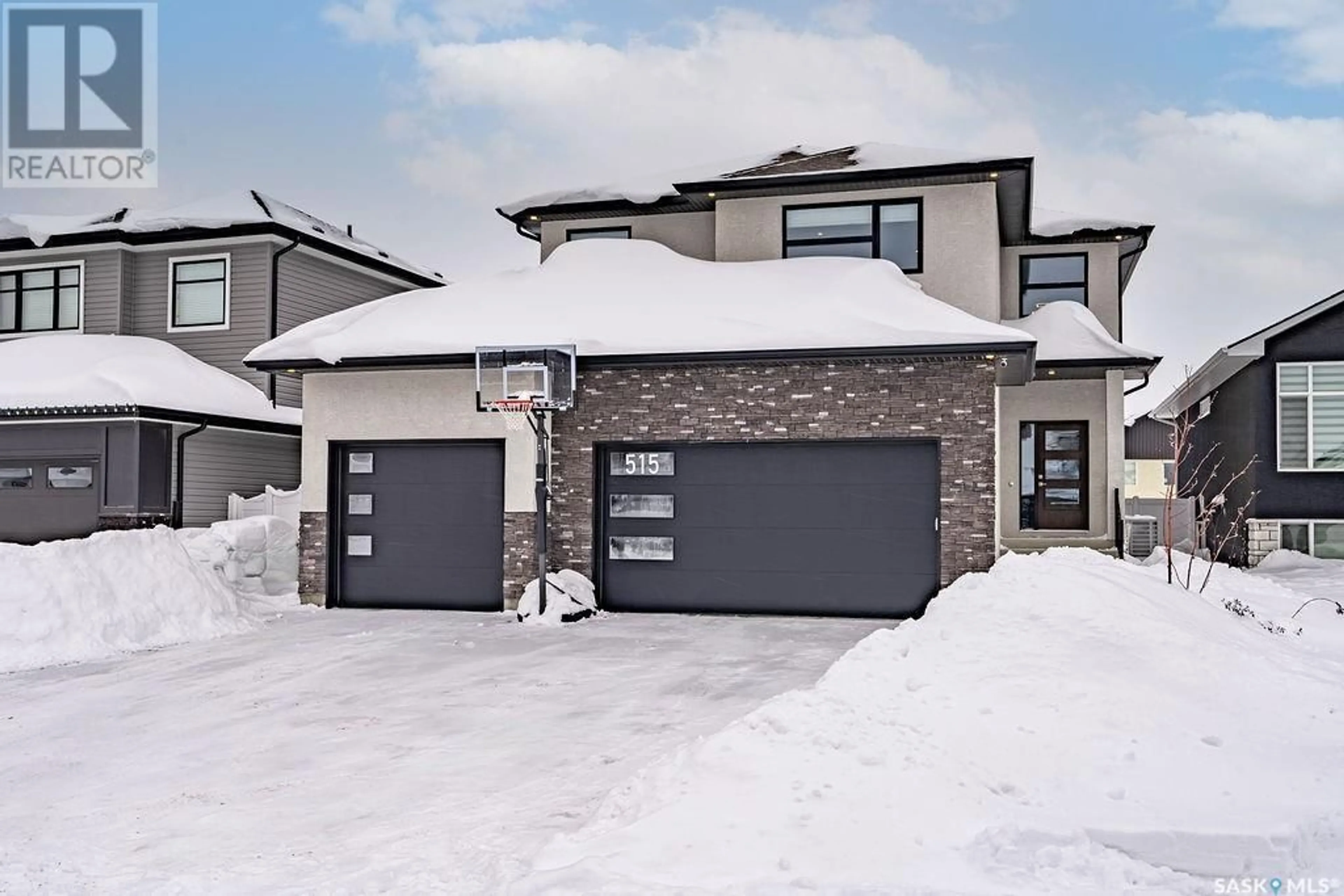 Home with brick exterior material, street for 515 KENASCHUK WAY, Saskatoon Saskatchewan S7W0C2