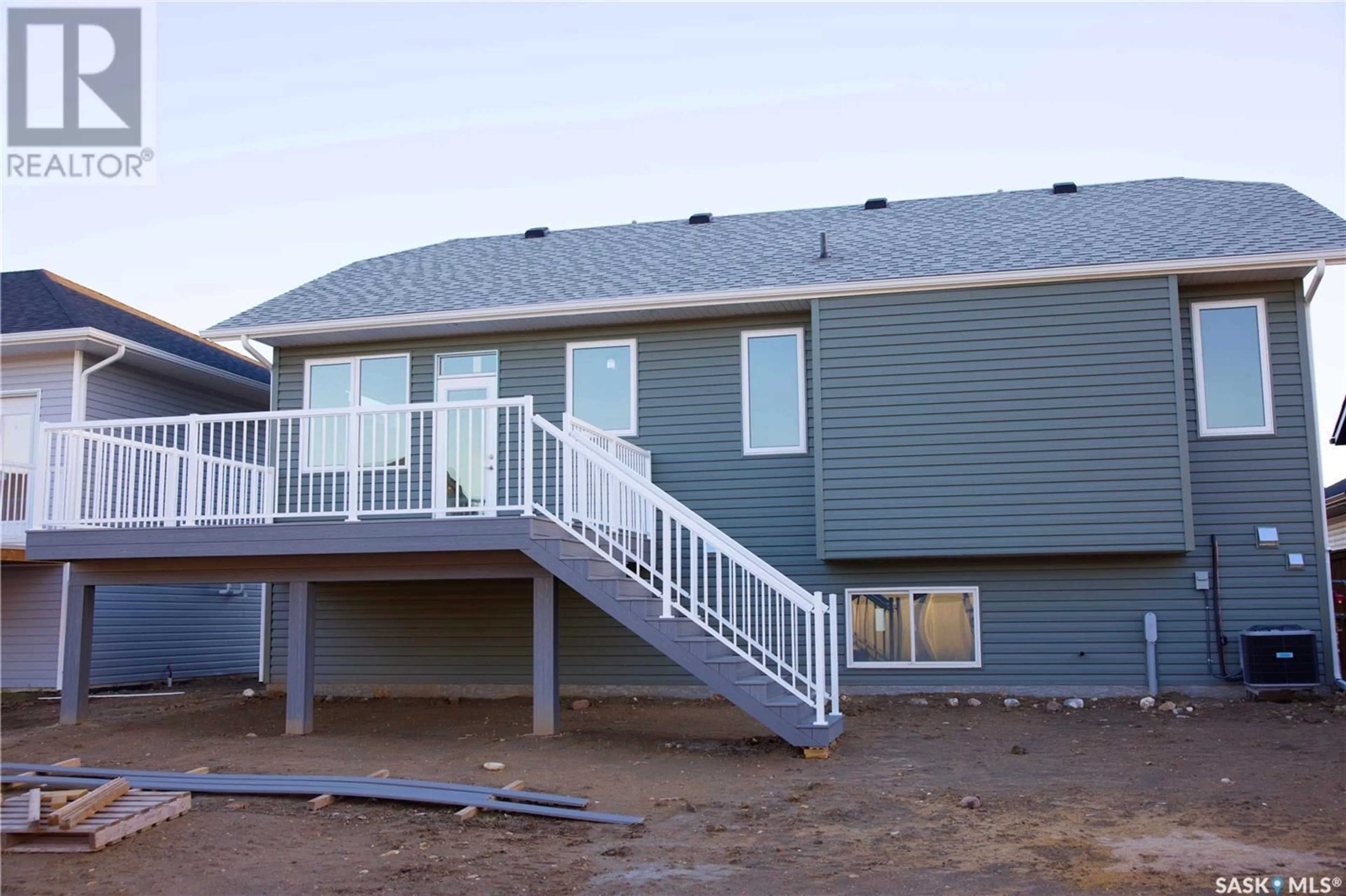 Frontside or backside of a home, the front or back of building for 608 Weir CRESCENT, Warman Saskatchewan S0K4S1