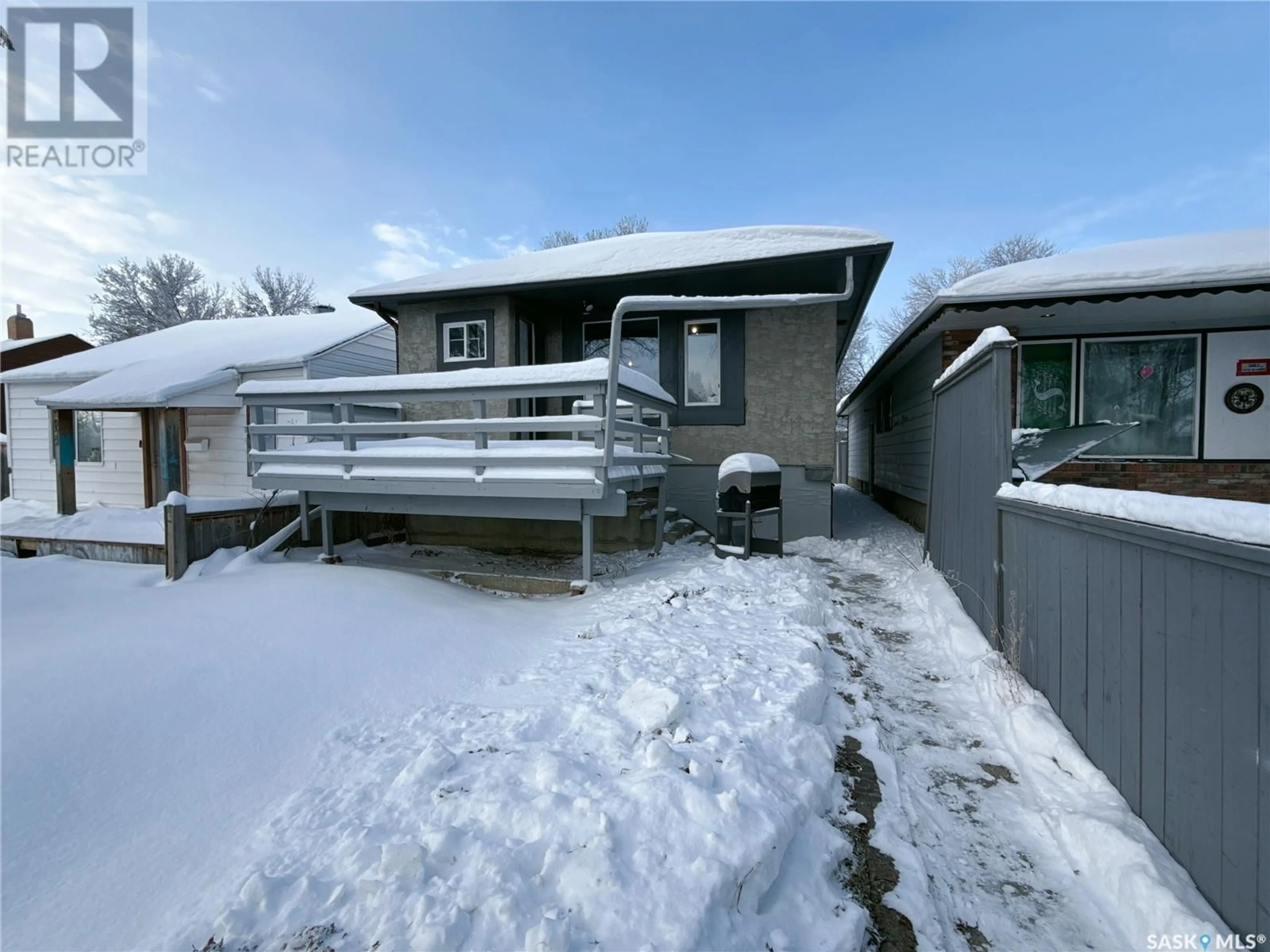 Frontside or backside of a home, the fenced backyard for 916 Athol STREET, Regina Saskatchewan S4T3B7