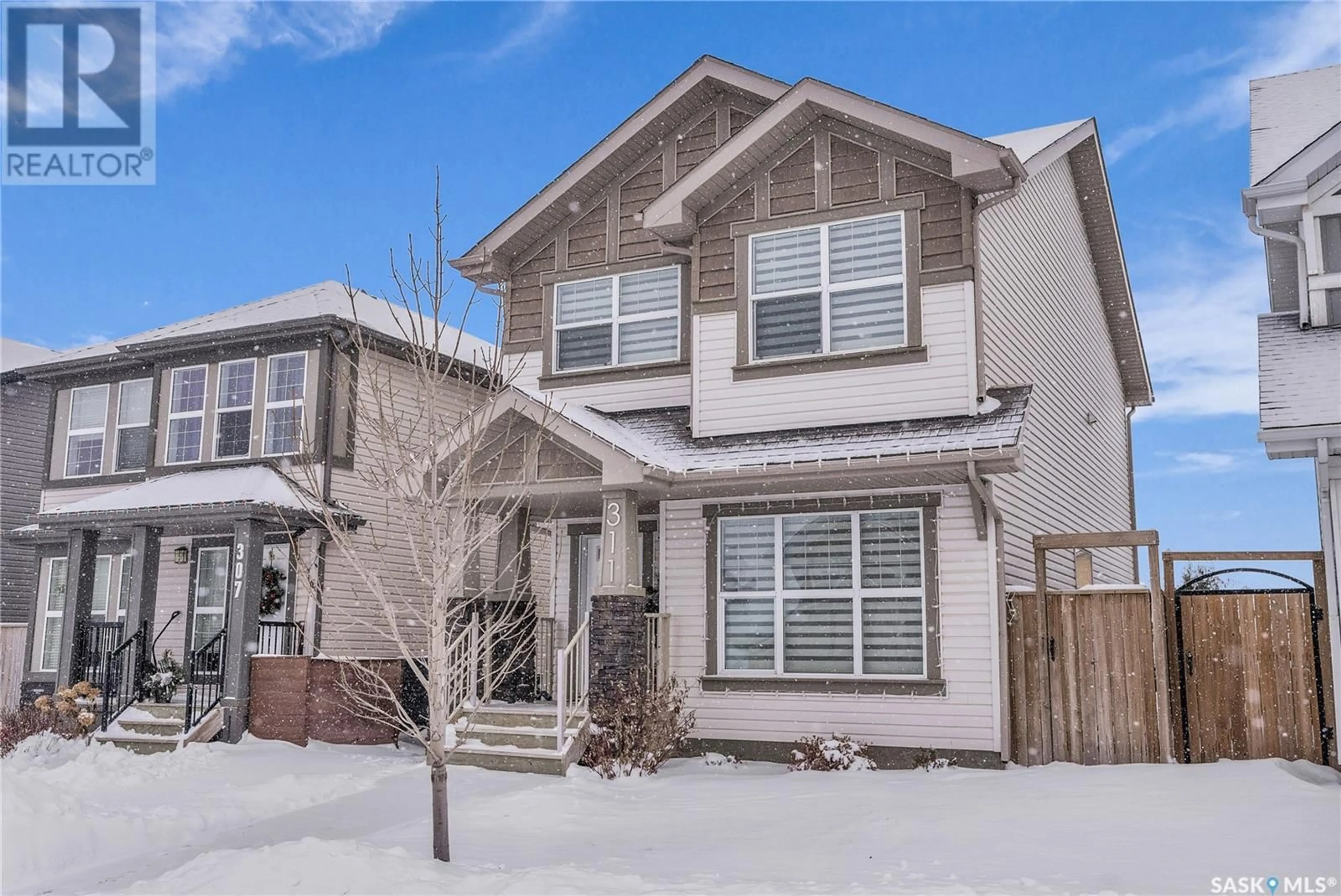 Frontside or backside of a home, the street view for 311 Delainey MANOR, Saskatoon Saskatchewan S7V0N4