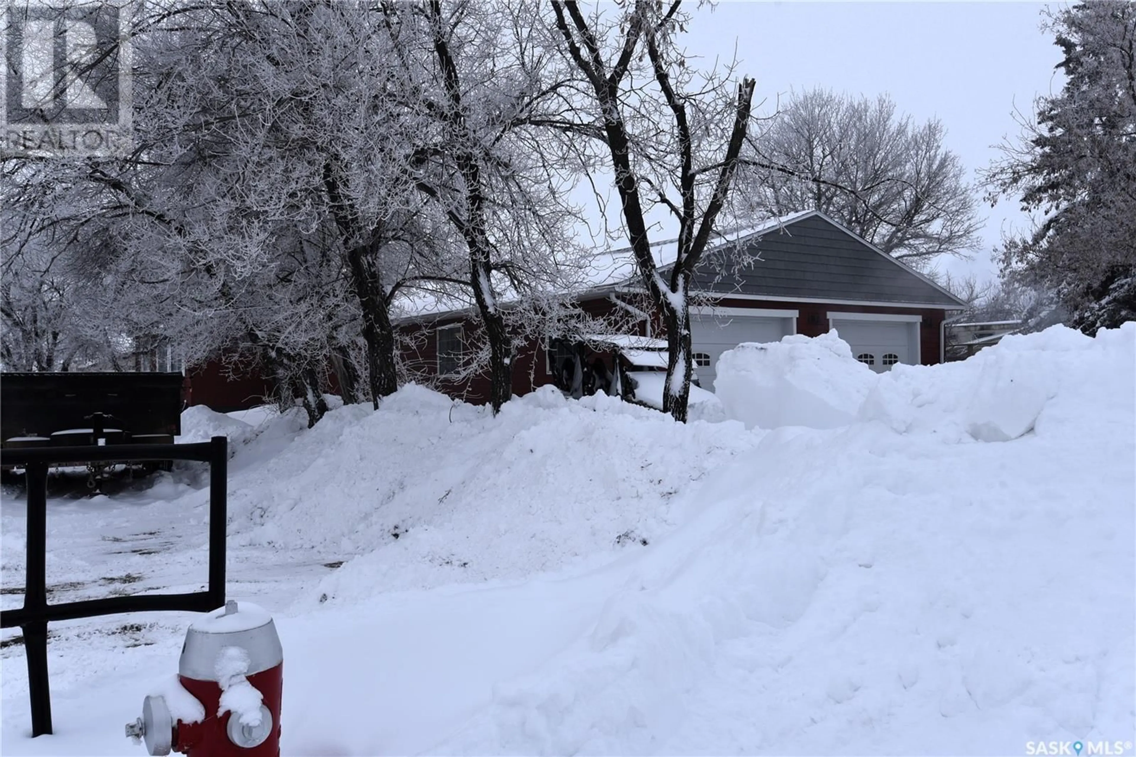 Frontside or backside of a home, the fenced backyard for 151 Birch ROAD, Carrot River Saskatchewan S0E0L0