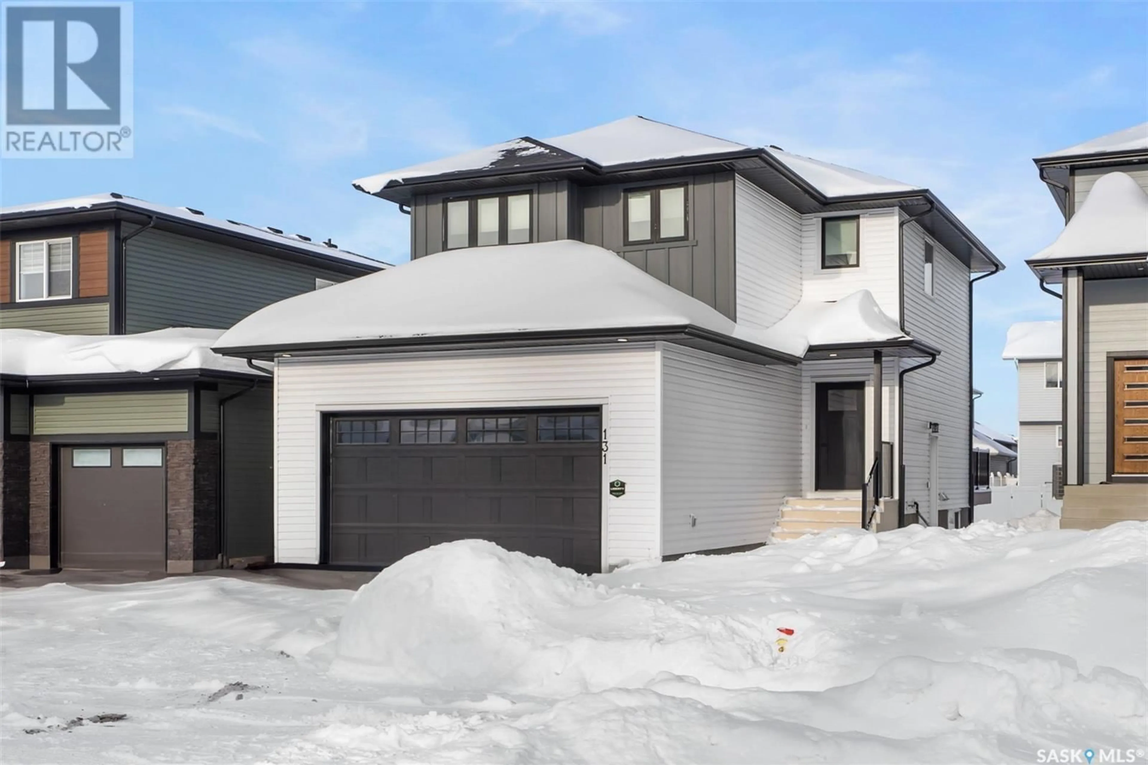 Frontside or backside of a home, the street view for 131 Barrett STREET, Saskatoon Saskatchewan S7W0Z6