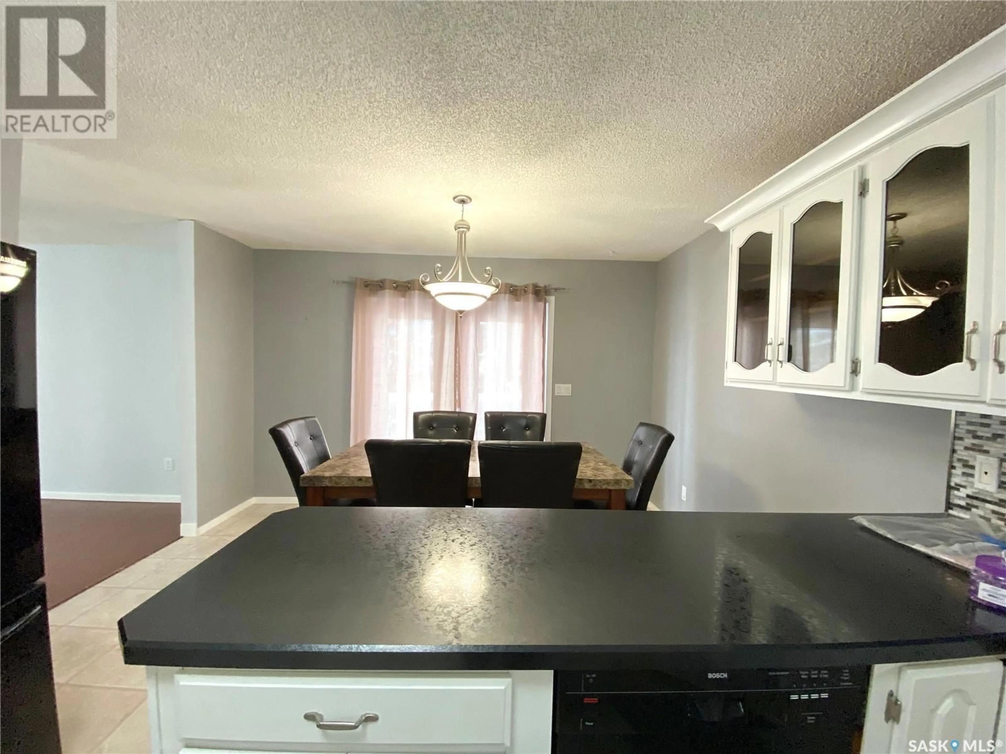 Open concept kitchen, wood/laminate floor for 233 LORNE STREET, Swift Current Saskatchewan S9H0J6