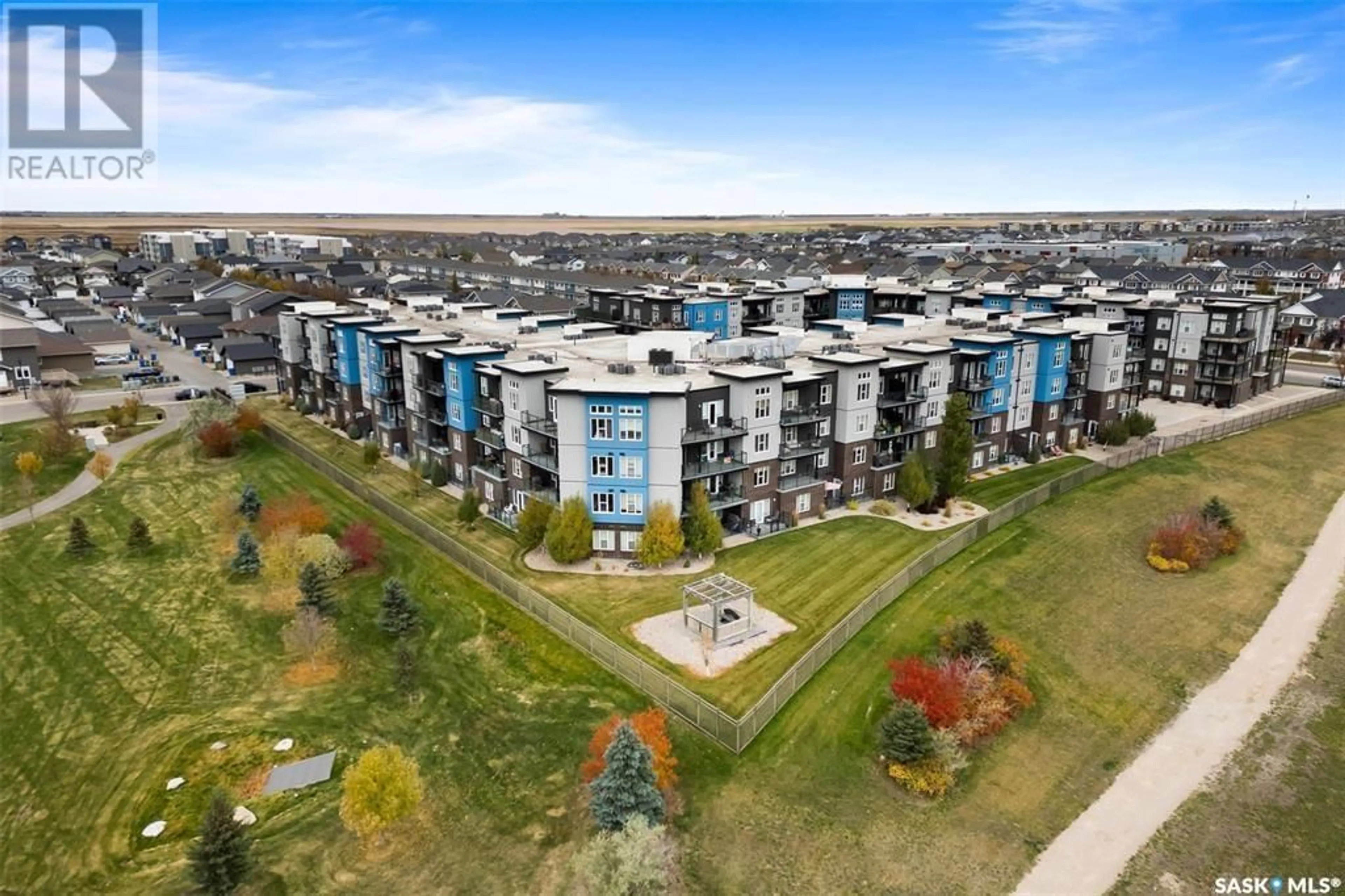 A pic from exterior of the house or condo, the view of city buildings for 213 5303 Universal CRESCENT, Regina Saskatchewan S4W0L1