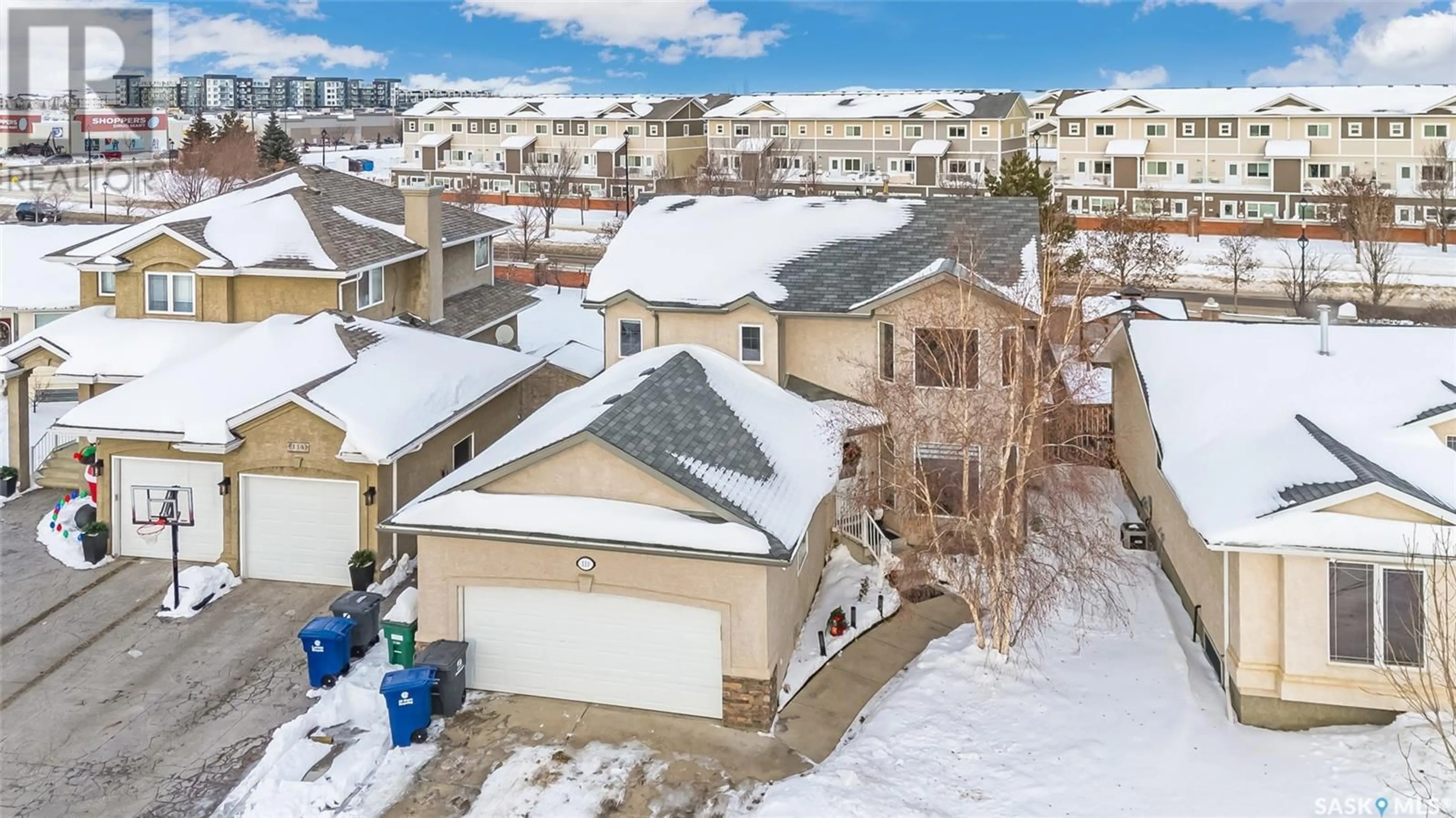 A pic from exterior of the house or condo, the fenced backyard for 110 Maguire COURT, Saskatoon Saskatchewan S7W1A2