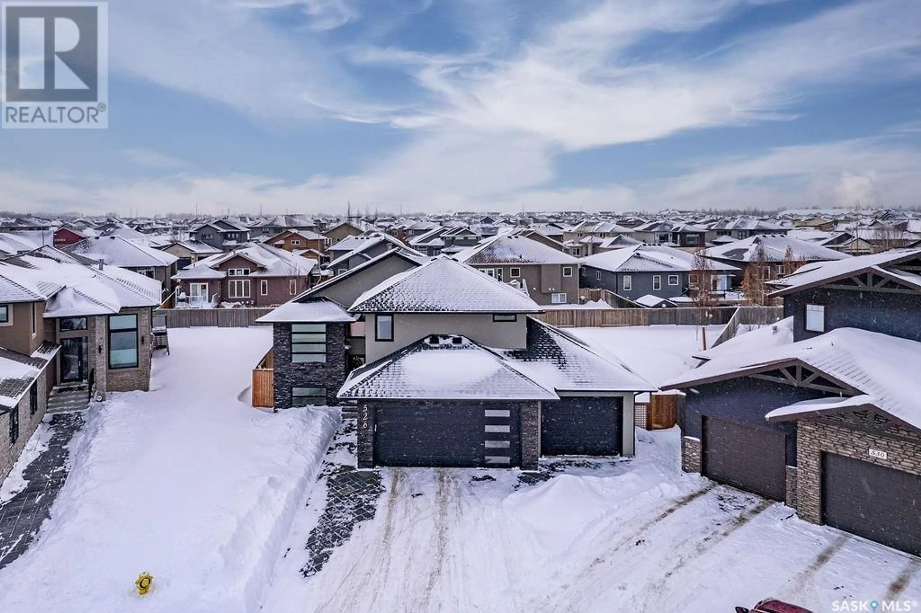 A pic from outside/outdoor area/front of a property/back of a property/a pic from drone, street for 526 Gillies COVE, Saskatoon Saskatchewan S7V0C1