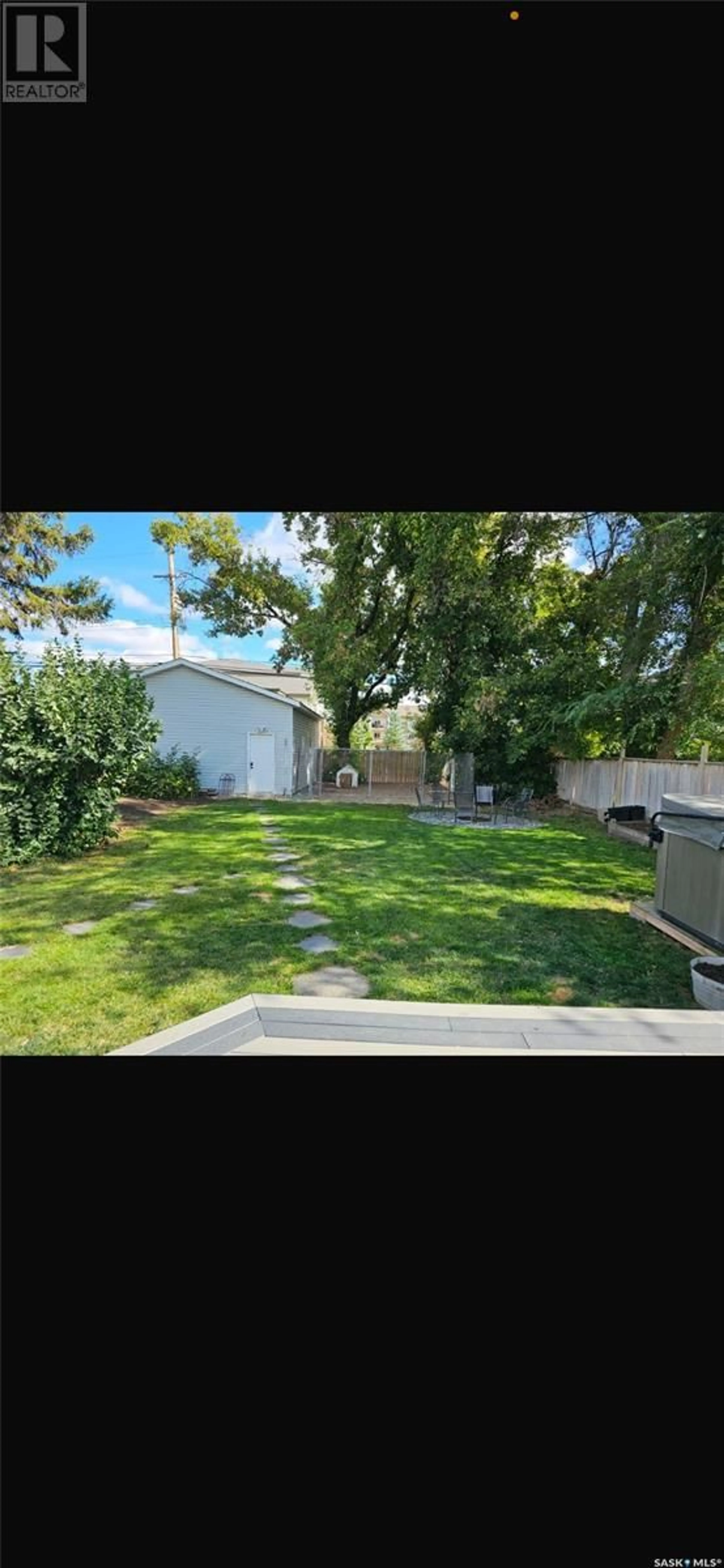 A pic from outside/outdoor area/front of a property/back of a property/a pic from drone, street for 2417 Clarence AVENUE S, Saskatoon Saskatchewan S7J1M1