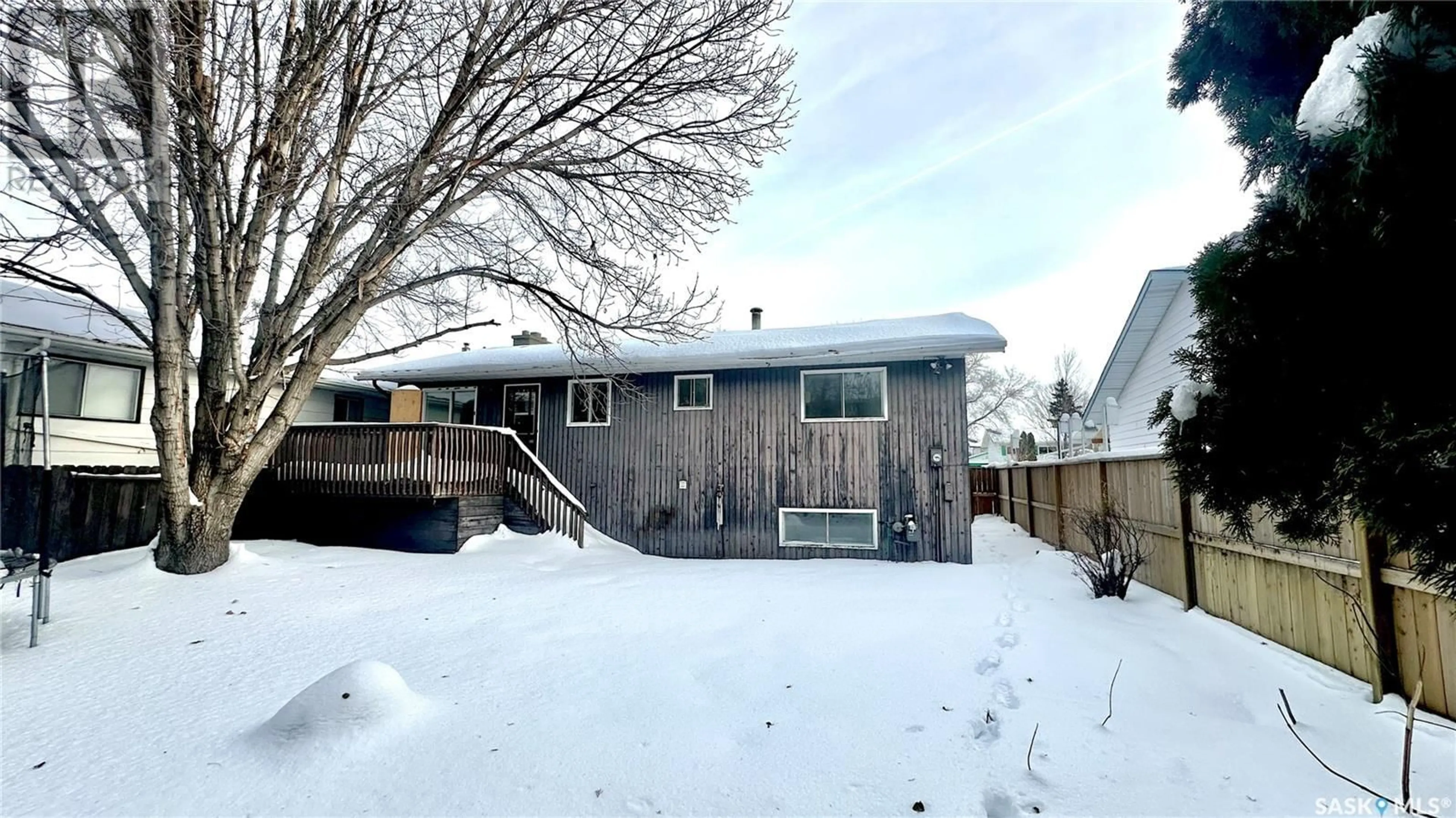 Frontside or backside of a home, the fenced backyard for 638 REDBERRY ROAD, Saskatoon Saskatchewan S7K4S5