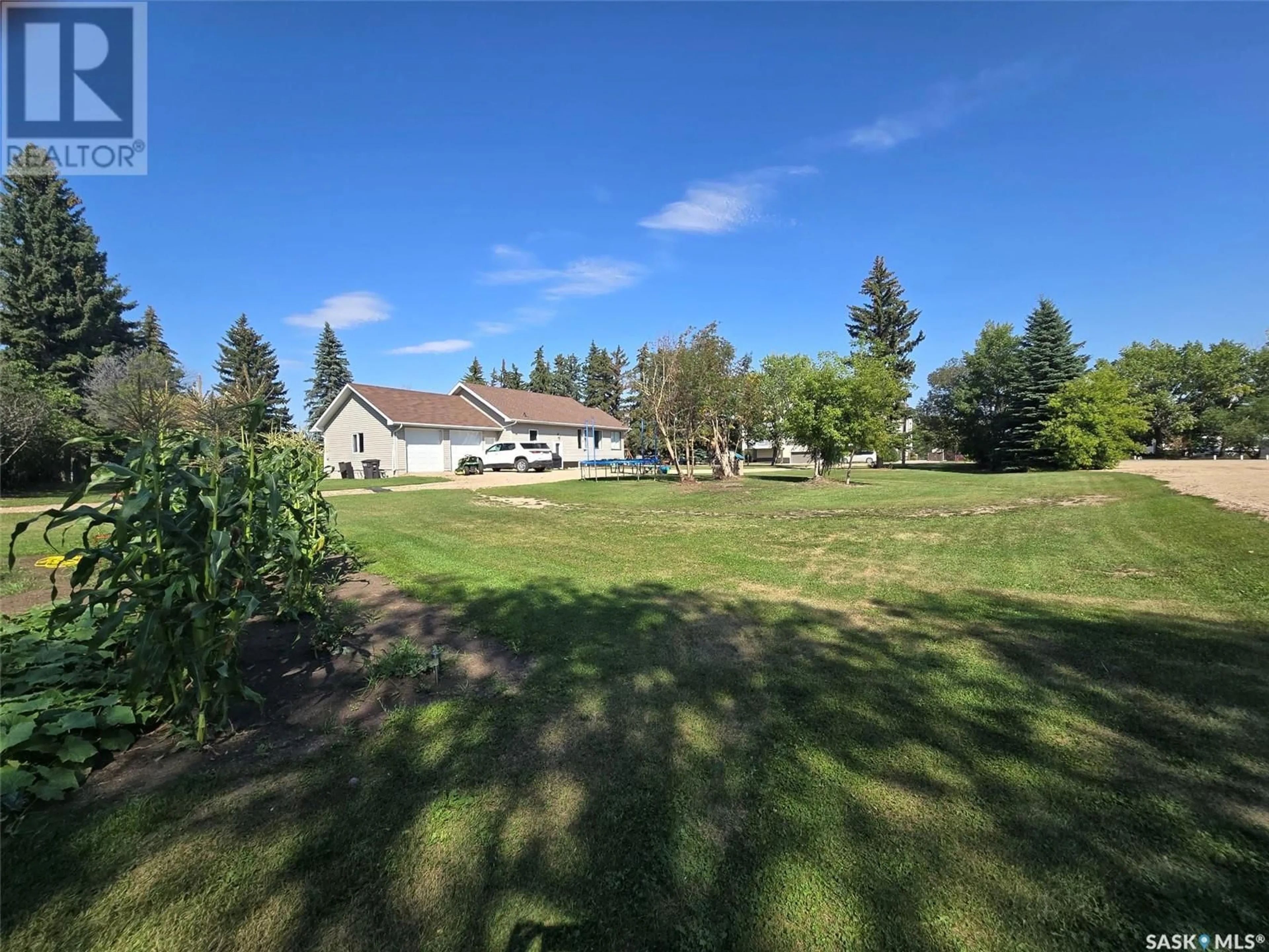 A pic from exterior of the house or condo, the fenced backyard for 35 Mayo STREET, Lanigan Saskatchewan S0K2M0