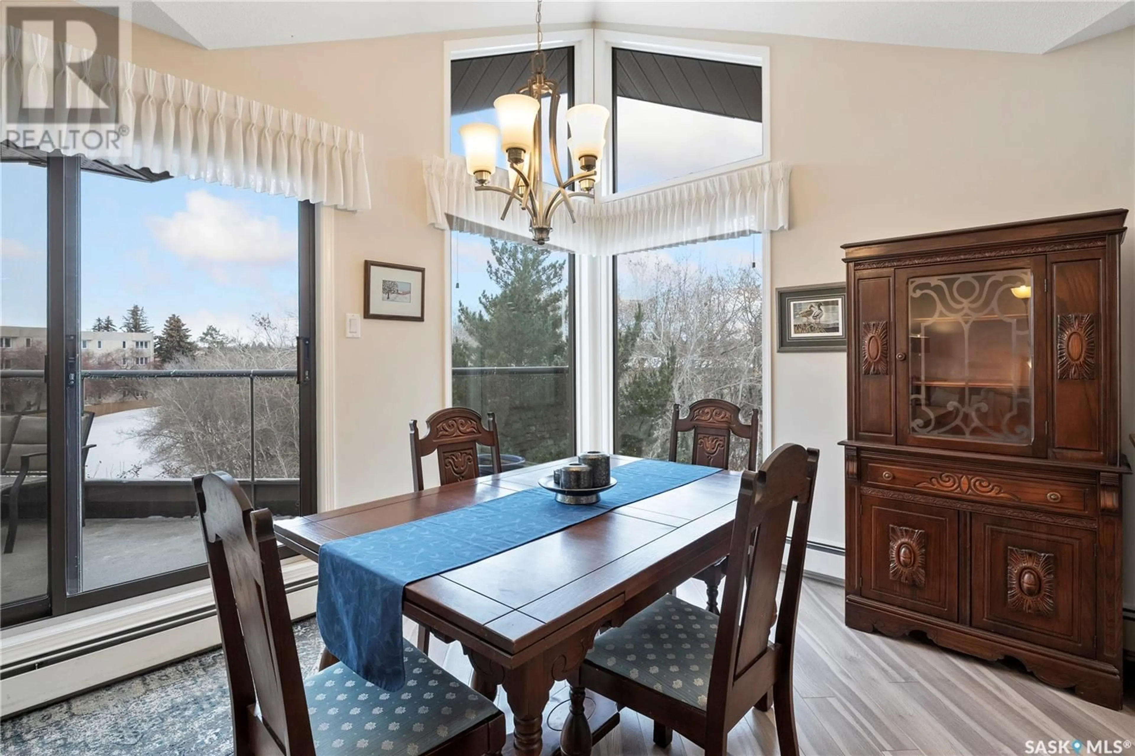 Dining room, wood/laminate floor for 301 2305 Adelaide STREET, Saskatoon Saskatchewan S7J5H6