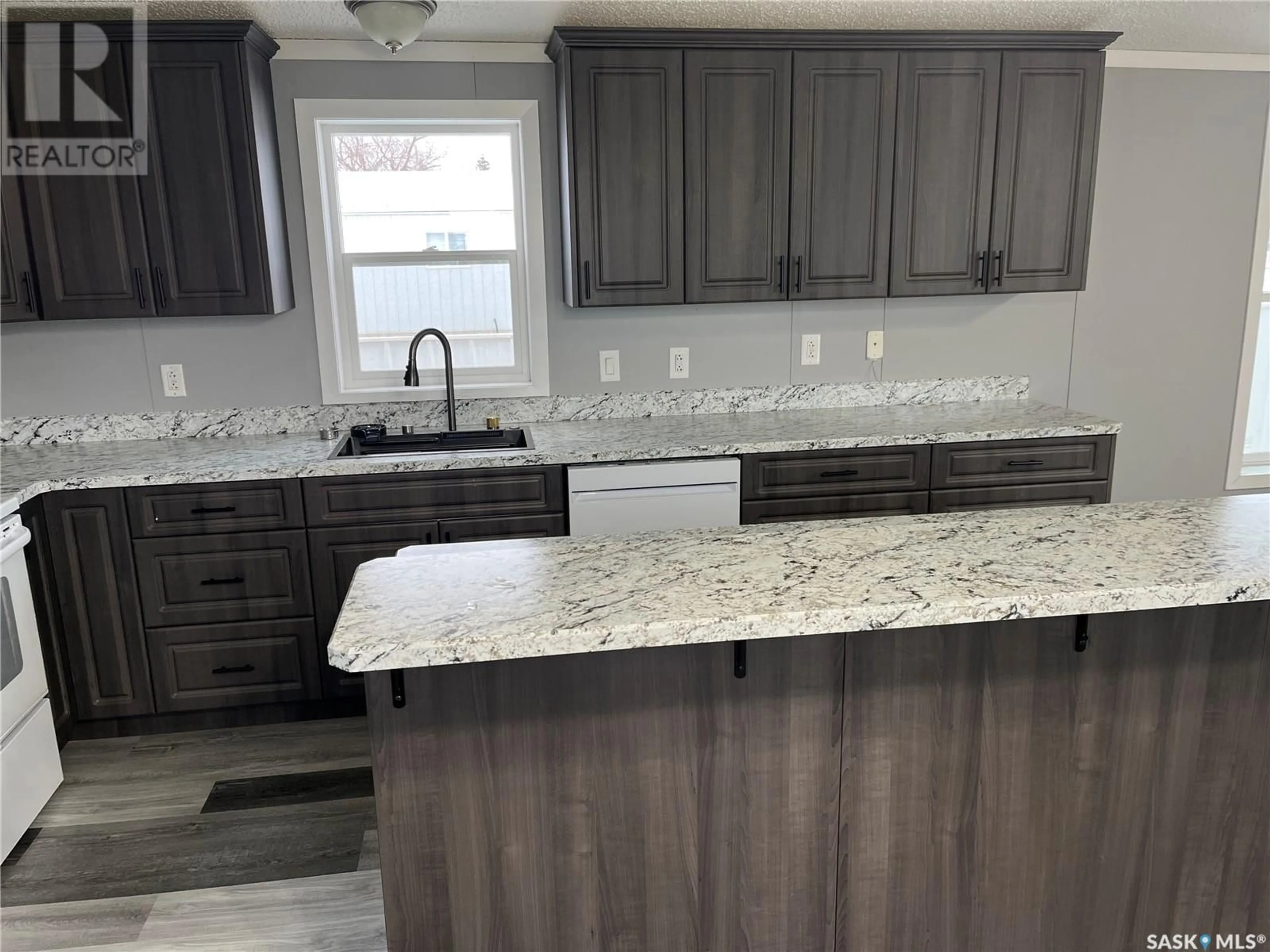 Open concept kitchen, ceramic/tile floor for 341 10TH AVENUE, Weyburn Saskatchewan S4H2R8
