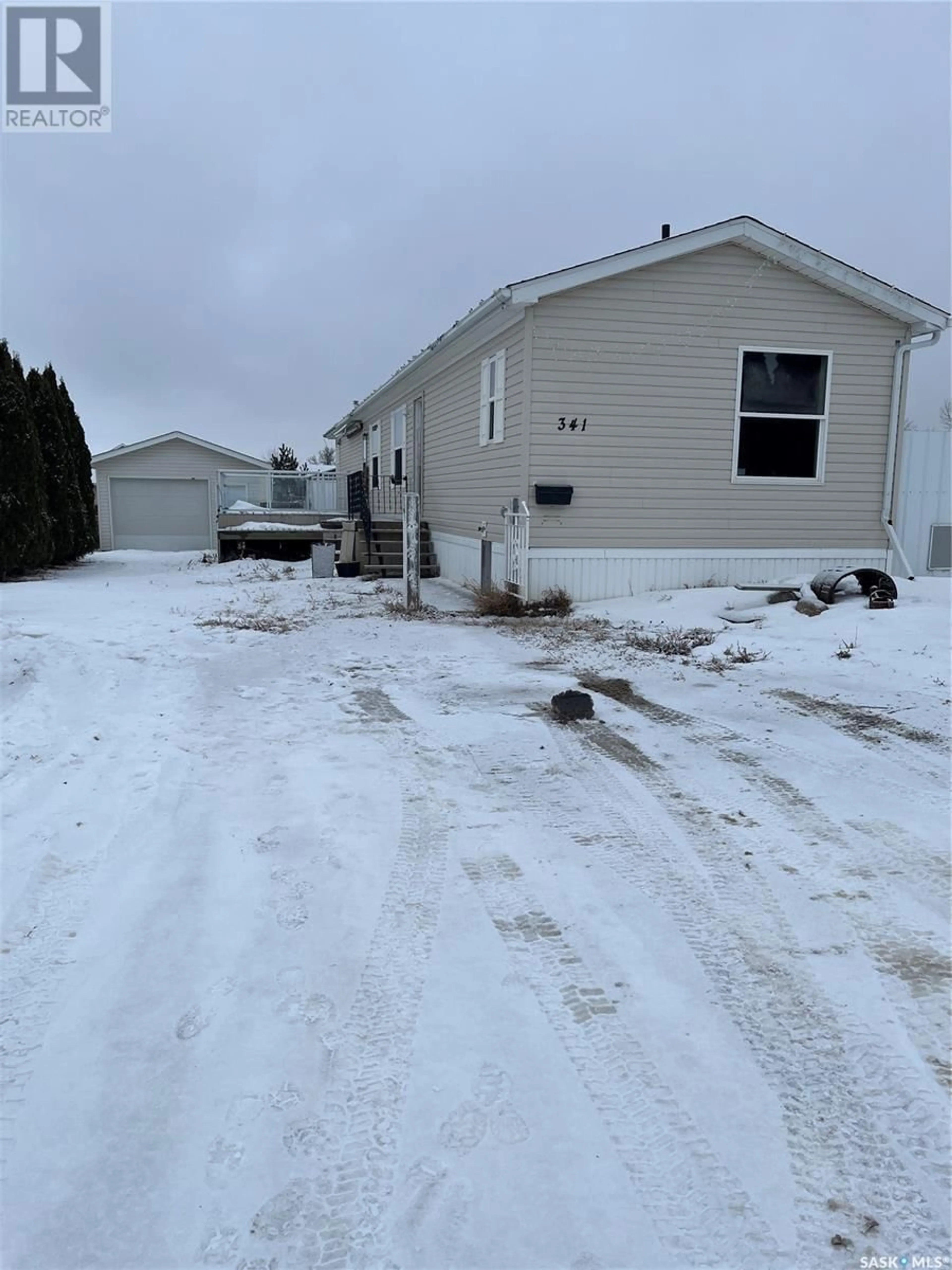 Frontside or backside of a home, the street view for 341 10th AVENUE S, Weyburn Saskatchewan S4H2R8