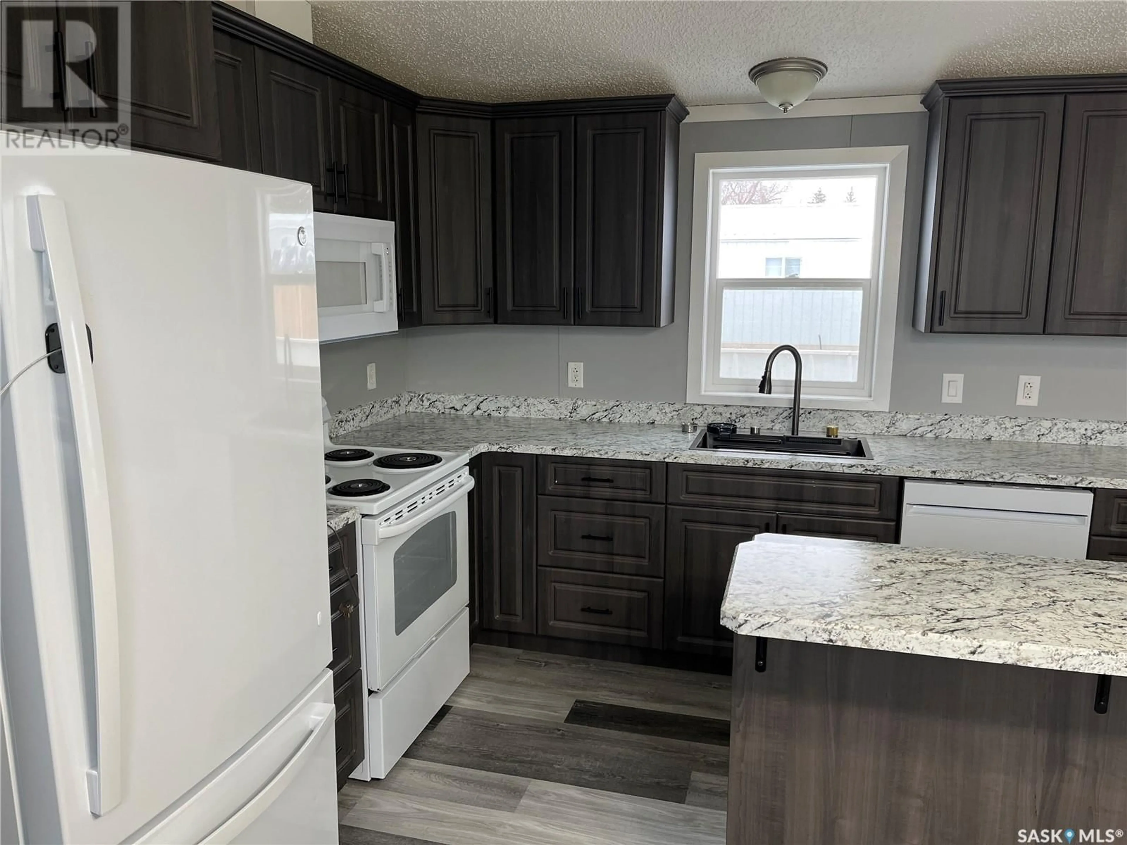 Standard kitchen, wood floors, cottage for 341 10th AVENUE S, Weyburn Saskatchewan S4H2R8